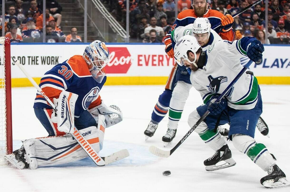 Vancouver Canucks’ Conor Garland (8) is stopped by Edmonton Oilers goalie Calvin Pickard (30) during first period second-round NHL playoff action in Edmonton on Tuesday May 14, 2024.THE CANADIAN PRESS/Jason Franson