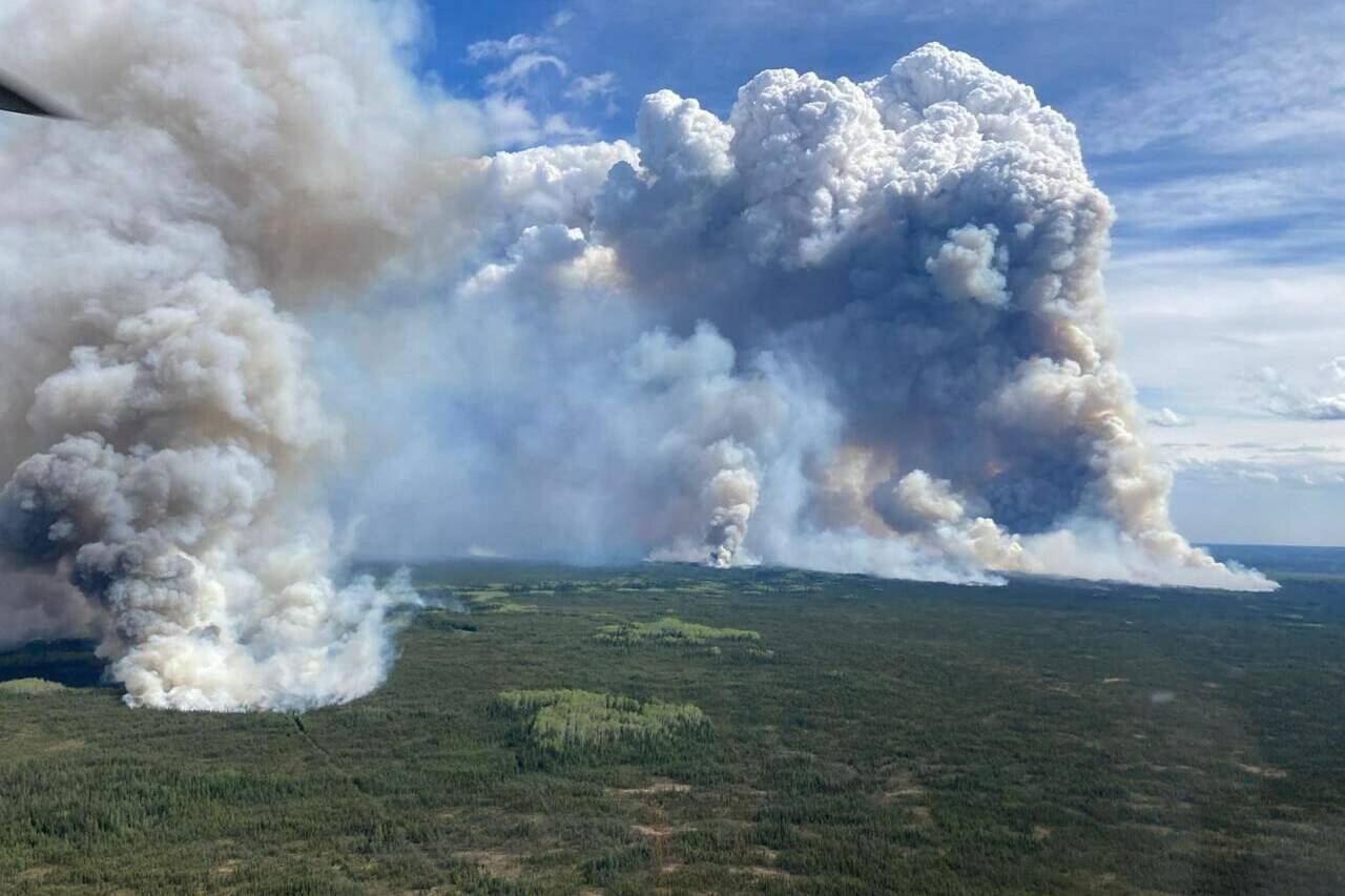 A view of the Parker Lake wildfire near Fort Nelson, B.C. is shown on Monday, May 13, 2024 in a BC Wildfire Service handout photo. British Columbia’s wildfire service says there’s potential for gusty winds to fan aggressive fire behaviour in the north, where out-of-control have forced several thousand people to leave their homes. THE CANADIAN PRESS/HO-BC Wildfire Service