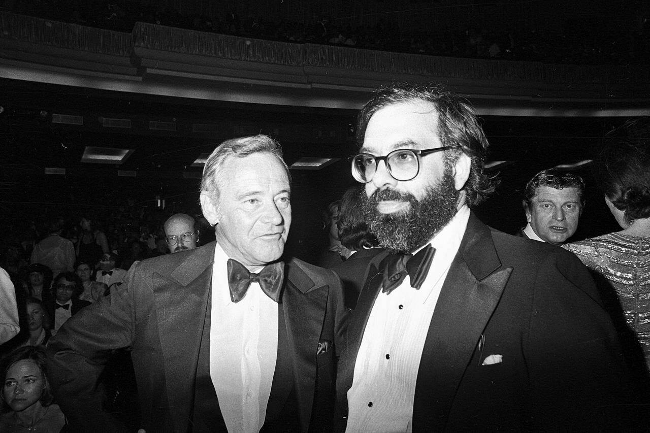 FILE - Directors Volker Schlondorff, left, and Francis Ford Coppola, winners of the Palm D'Or prize, are shown at the awards ceremony at Cannes International Film Festival on May 25, 1979. Schlondorff directed "The Tin Drum," and Coppola directed "Apocalypse Now." (AP Photo, File)