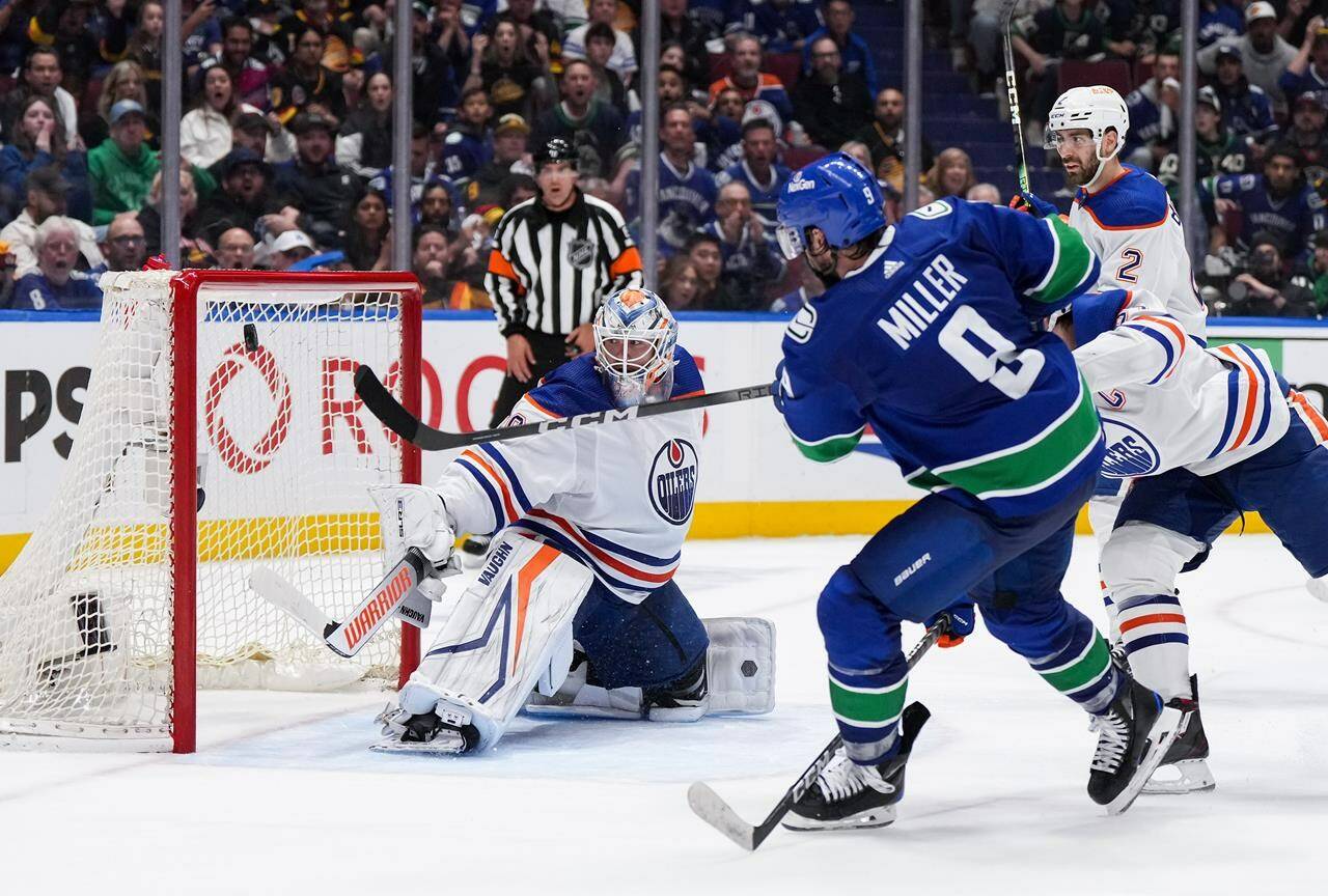 Vancouver Canucks’ J.T. Miller (9) scores the winning goal against Edmonton Oilers goalie Calvin Pickard during the third period in Game 5 of an NHL hockey Stanley Cup second-round playoff series, in Vancouver, on Thursday, May 16, 2024. THE CANADIAN PRESS/Darryl Dyck