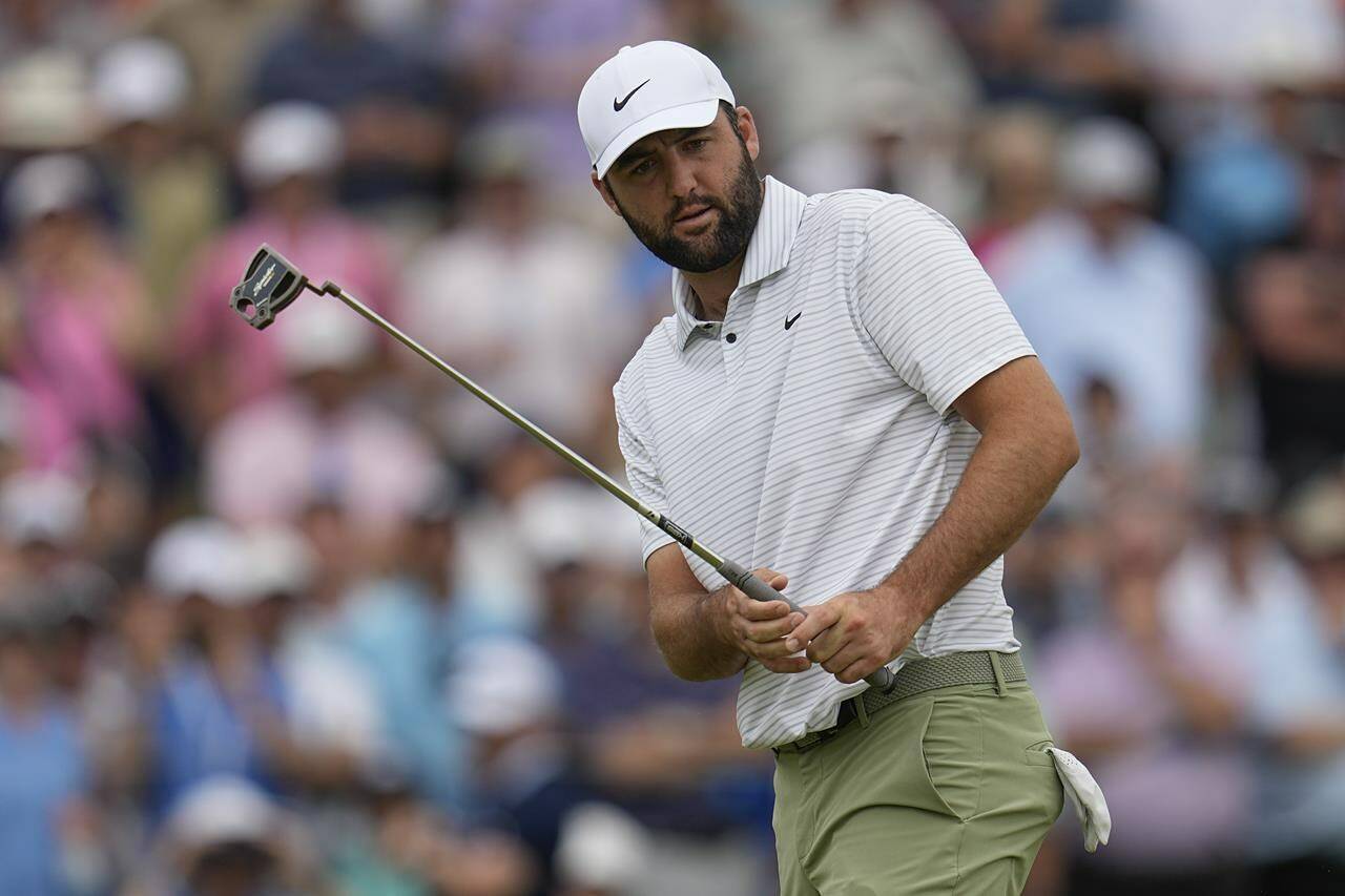 Scottie Scheffler reacts after missing a putt on the seventh hole during the first round of the PGA Championship golf tournament at the Valhalla Golf Club, Thursday, May 16, 2024, in Louisville, Ky. (AP Photo/Sue Ogrocki)