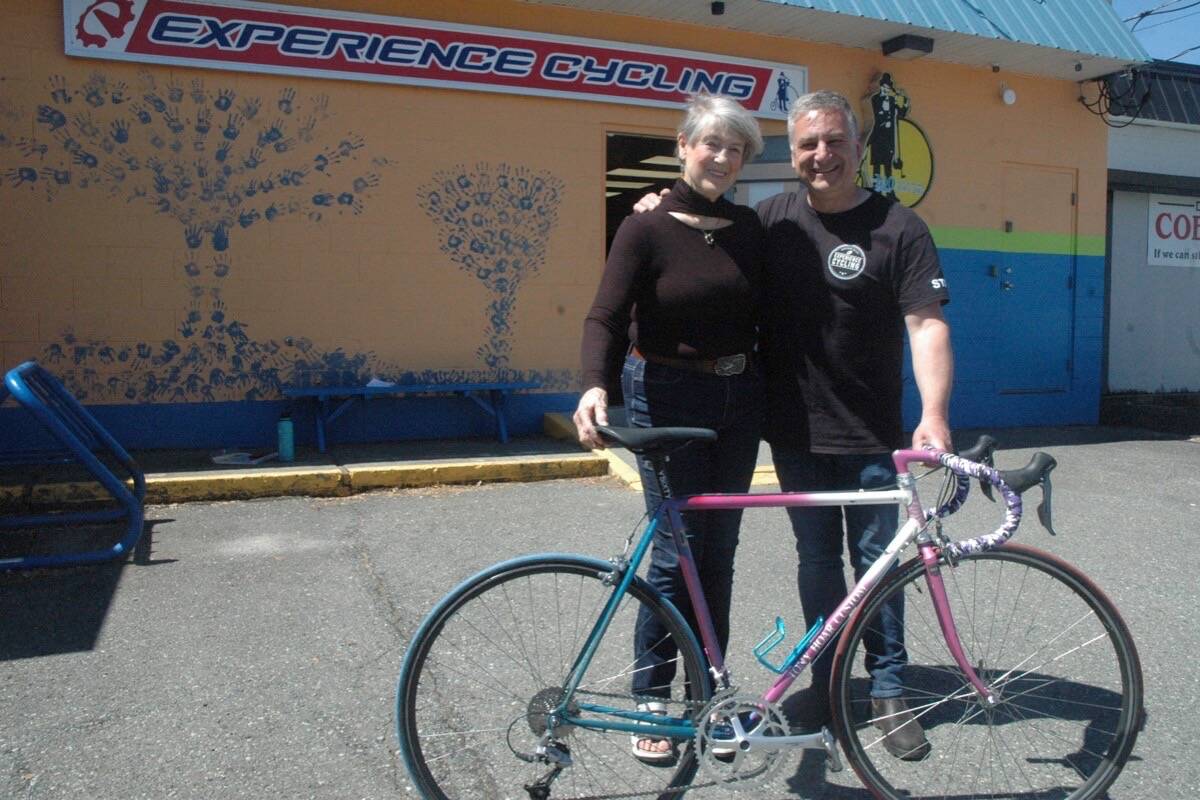 Former competitive bike racer Gay Wise poses with Will Arnold, owner of Duncan’s Experience Cycling, and her bike that was stolen decades ago in Vancouver that was recently found and returned to her. Arnold took on the project of restoring the bike, which was in bad condition when found, and resurrected it for a grateful Wise. (Robert Barron/Citizen)