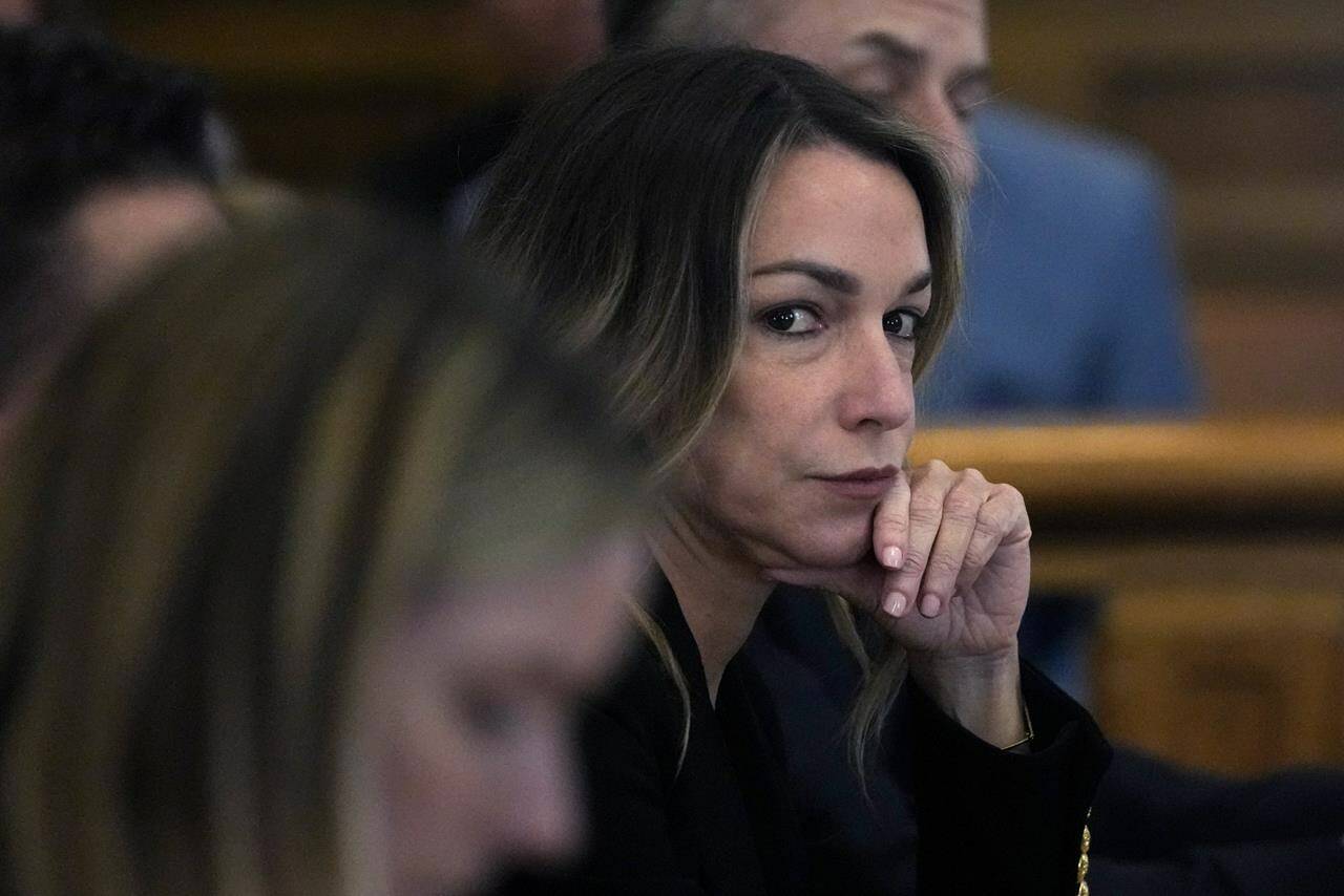 Karen Read listens to testimony during her trial at Norfolk County Superior Court, Friday, May 17, 2024, in Dedham, Mass. Read, 44, is accused of running into her Boston police officer boyfriend with her SUV in the middle of a nor’easter and leaving him for dead after a night of heavy drinking. (AP Photo/Charles Krupa, Pool)