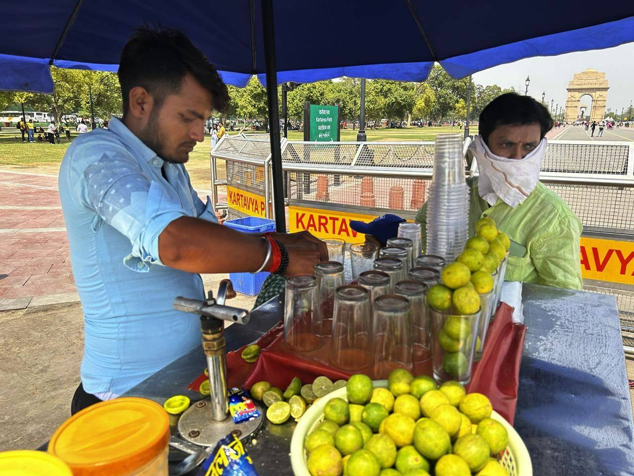 A roadside vendor sells iced lemonade in New Delhi, India, Saturday, May 18, 2024. Swathes of northwest India sweltered under scorching temperatures on Saturday, with the capital New Delhi under a severe weather alert as extreme temperatures strike parts of the country. (AP Photo/Shonal Ganguly)