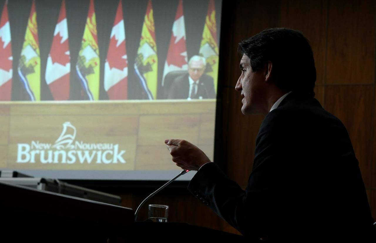 Prime Minister Justin Trudeau says he has “issues” with the Progressive Conservative government of New Brunswick. New Brunswick Premier Blaine Higgs is seen via video conference as Prime Minister Justin Trudeau speaks during an announcement on early learning and child care in New Brunswick, in Ottawa, on Monday, Dec. 13, 2021. THE CANADIAN PRESS/Justin Tang
