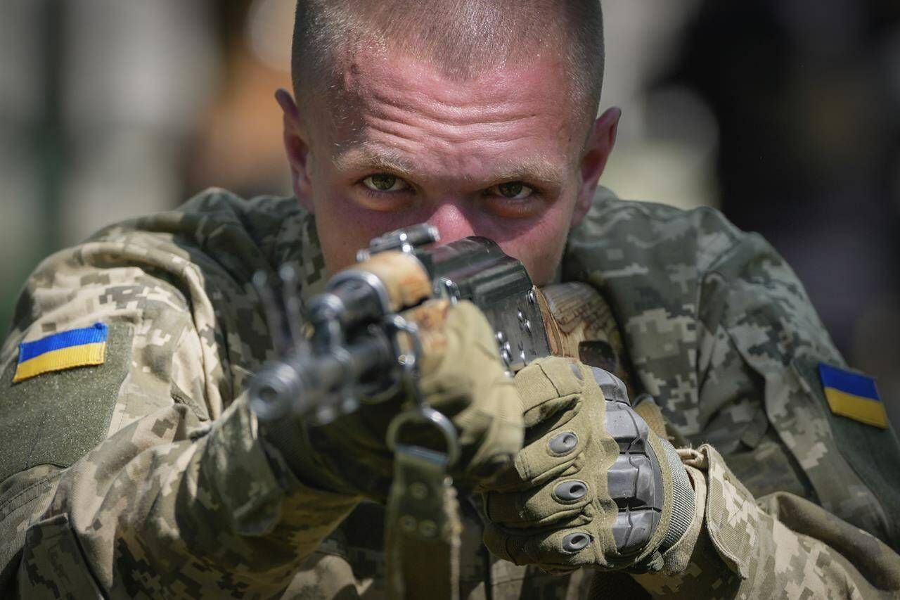 A newly recruited soldier of the 3rd assault brigade trains, in Kyiv, Ukraine, Friday, May 17, 2024. A divisive mobilisation law in Ukraine came into force on Saturday, as Kyiv struggles to boost troop numbers after Russia launched a new offensive. (AP Photo/Efrem Lukatsky)