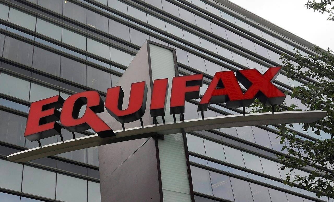 Equifax Canada says it’s exploring how using payday loan data could affect people’s credit scores. Signage is seen at the corporate headquarters of Equifax Inc. in Atlanta, Saturday, July 21, 2012. THE CANADIAN PRESS/AP-Mike Stewart
