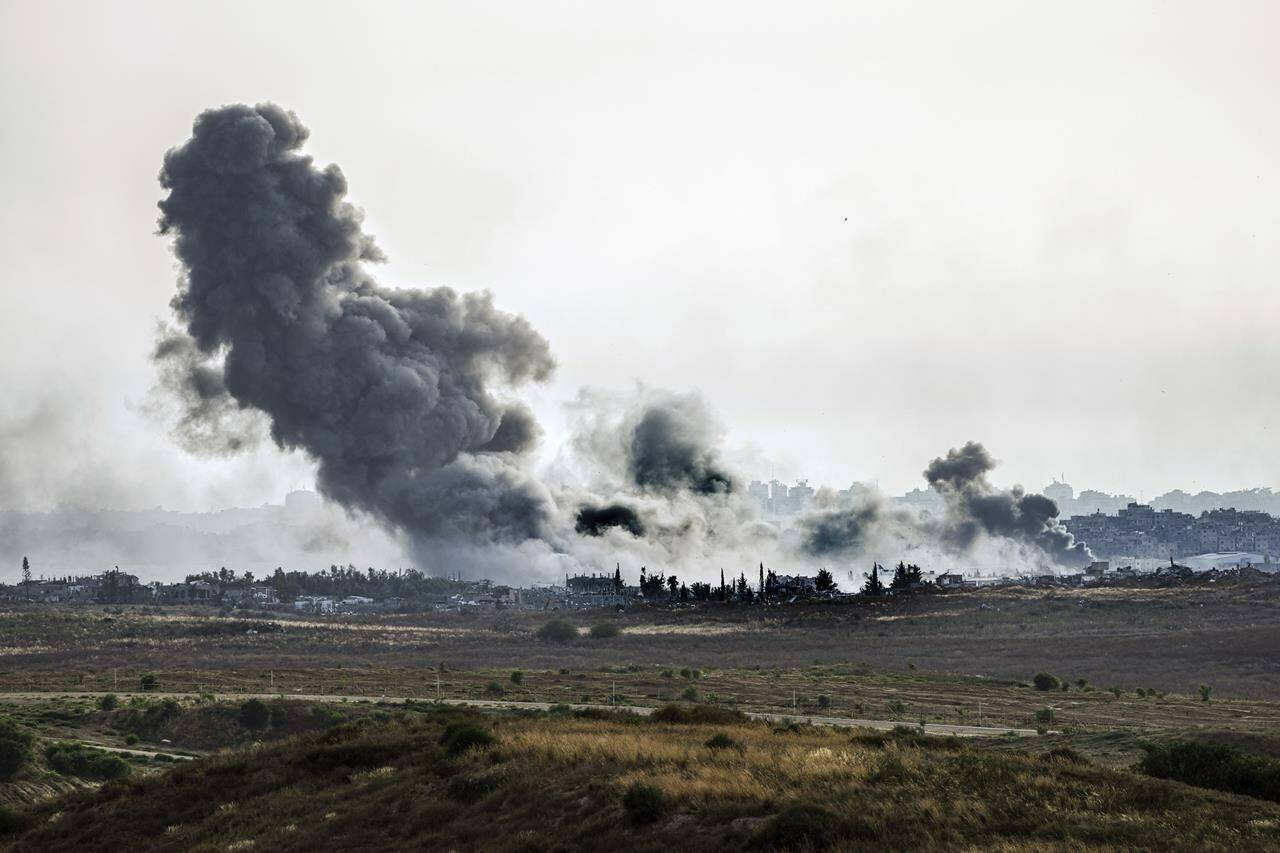 Lawyers across Canada are crying foul after Canada’s immigration department asked a medical worker fleeing the war in Gaza if he’d ever treated injured Hamas soldiers. Smoke rises following an Israeli airstrike in the Gaza Strip, as seen from southern Israel, Friday, May 17, 2024. THE CANADIAN PRESS/AP-Tsafrir Abayov