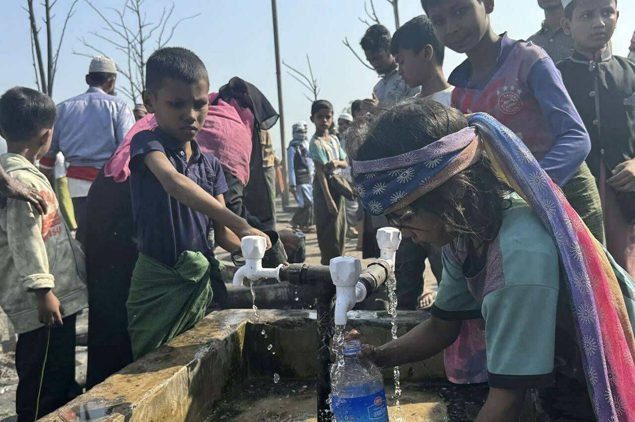 Canada’s ambassador to the United Nations says Ottawa is looking at ways to improve the “unbearable” suffering of Rohingya expelled from Myanmar, and to counter the military junta overseeing ethnic violence against Muslims. Rohingya refugee children collect drinking water after a midnight fire raced through their refugee camp at Kutupalong in Cox’s Bazar district, Bangladesh, Sunday, Jan. 7, 2024. THE CANADIAN PRESS/AP-Shafiqur Rahman