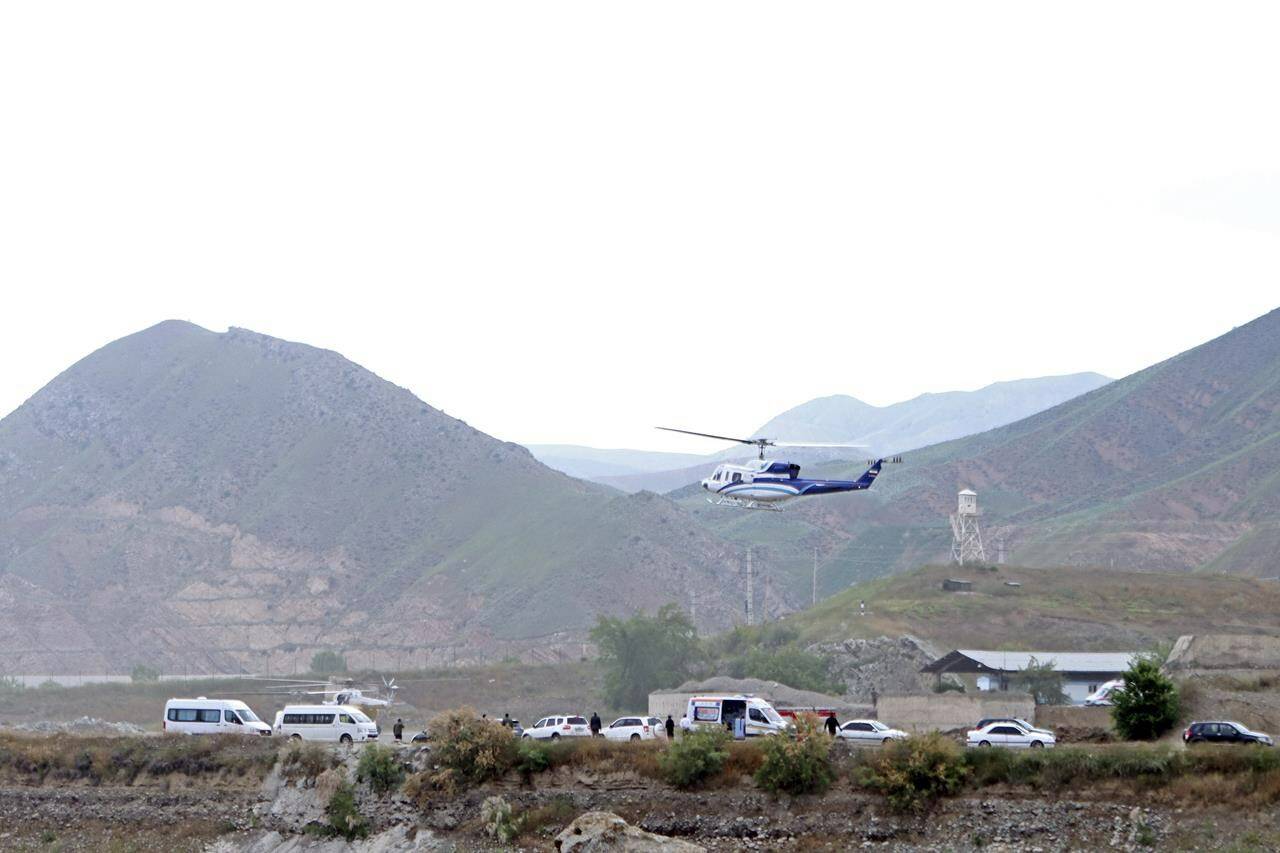 In this photo provided by Islamic Republic News Agency, IRNA, the helicopter carrying Iranian President Ebrahim Raisi takes off at the Iranian border with Azerbaijan after President Raisi and his Azeri counterpart Ilham Aliyev inaugurated dam of Qiz Qalasi, or Castel of Girl in Azeri, Iran, Sunday, May 19, 2024. A helicopter carrying President Raisi suffered a “hard landing” on Sunday, Iranian state media reported, without elaborating. (Ali Hamed Haghdoust/IRNA via AP)