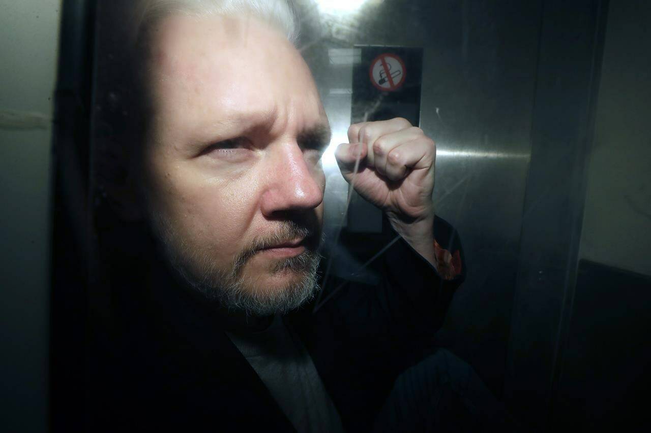 FILE - WikiLeaks founder Julian Assange being taken from court, where he appeared on charges of jumping British bail seven years ago, in London, Wednesday May 1, 2019. Assange faces what could be his final court hearing in England over whether he should be extradited to the United States to face spying charges. (AP Photo/Matt Dunham, File)