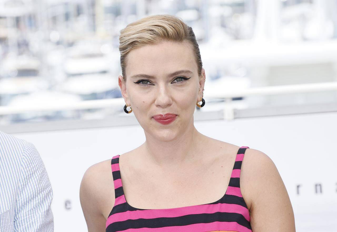 FILE - Scarlett Johansson poses for photographers at the photo call for the film “Asteroid City” at the 76th international film festival, Cannes, southern France, May 24, 2023. OpenAI plans to halt the use of one of its ChatGPT voices after some drew similarities to Johansson, who famously portrayed a fictional AI assistant in the (perhaps no longer so futuristic) film “Her.” (Photo by Joel C Ryan/Invision/AP, File)
