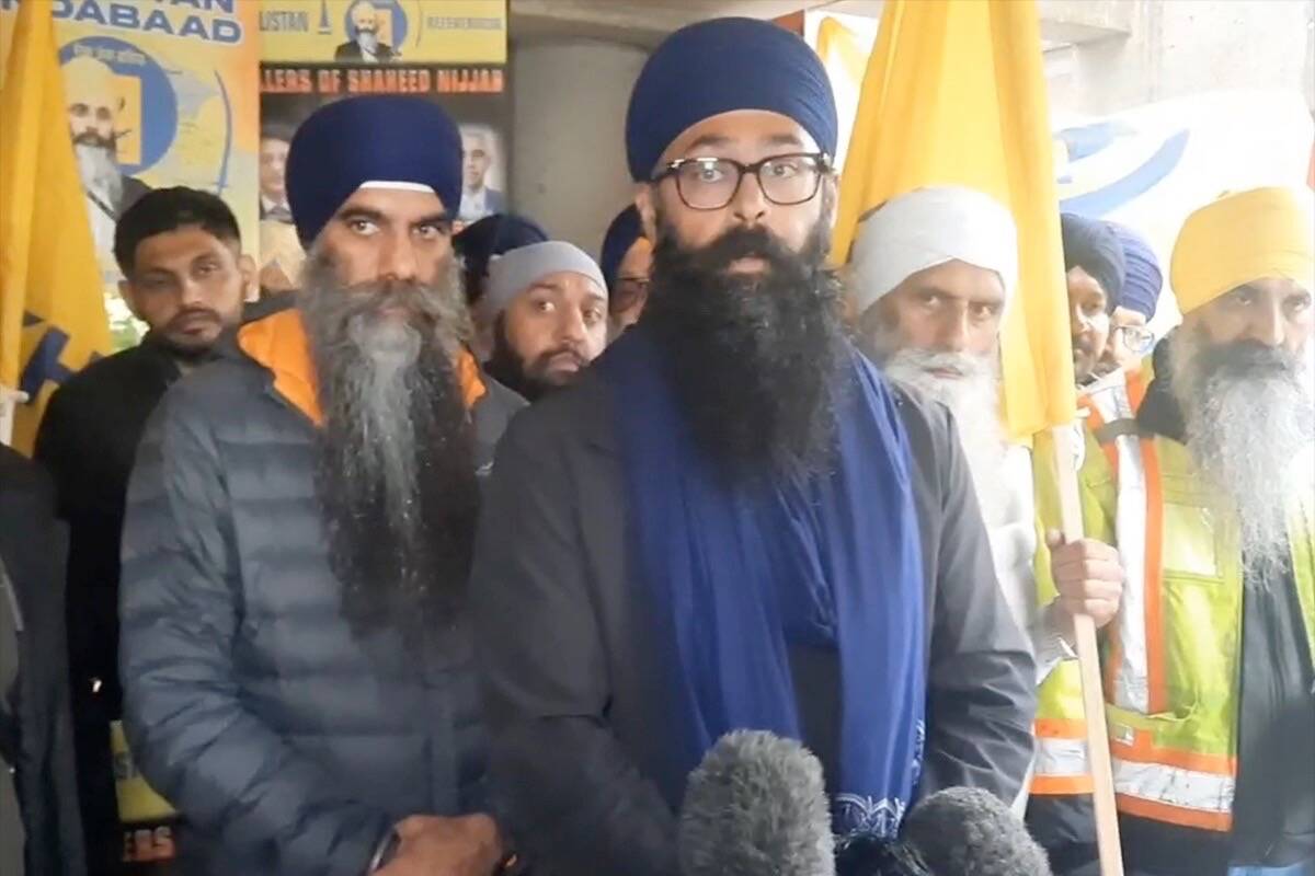 Moninder Singh, of the BC Gurdwaras Council, and to his right Bhupinder Singh Hothi, general secretary of Surrey’s Guru Nanak Gurdwara, speaking to the media outside Surrey provincial court on May 21. (Photo: Tom Zytaruk)
