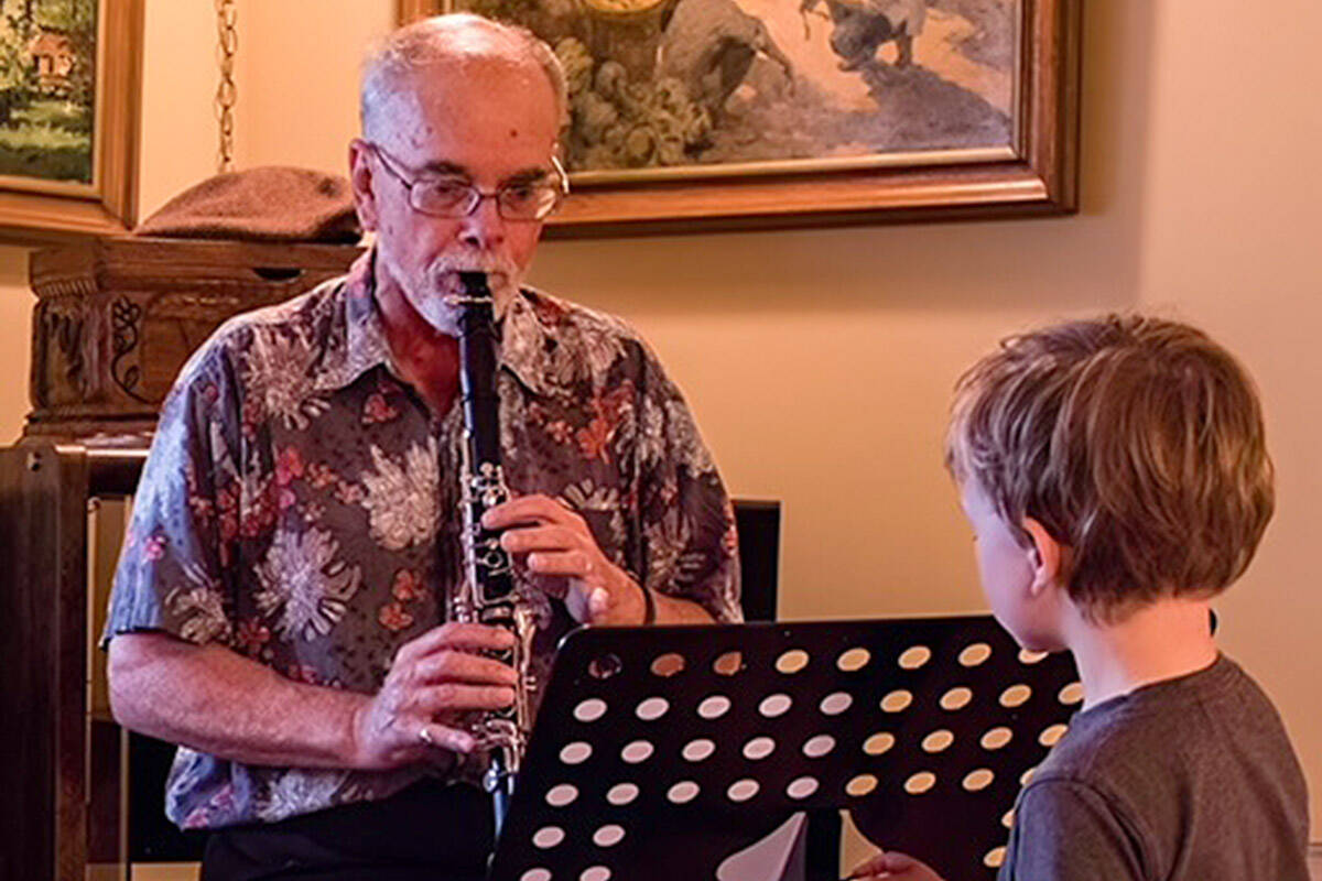 Ed Dunnett, playing clarinet for his grandson. (Contributed photo)