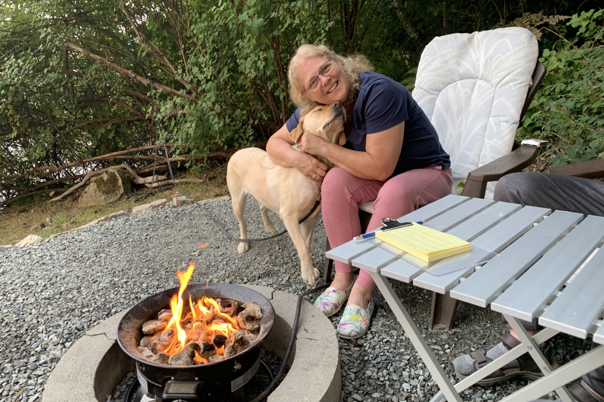 Sherry-Lynne MacWilliams and her seizure-trained Dog Guide, Venta, at their cabin on Vancouver Island. A fundraising walk on May 26 is set to raise funds to help breed and train dogs who help their guardians with epilepsy, diabetes and autism, among other issues. (Contributed photo)