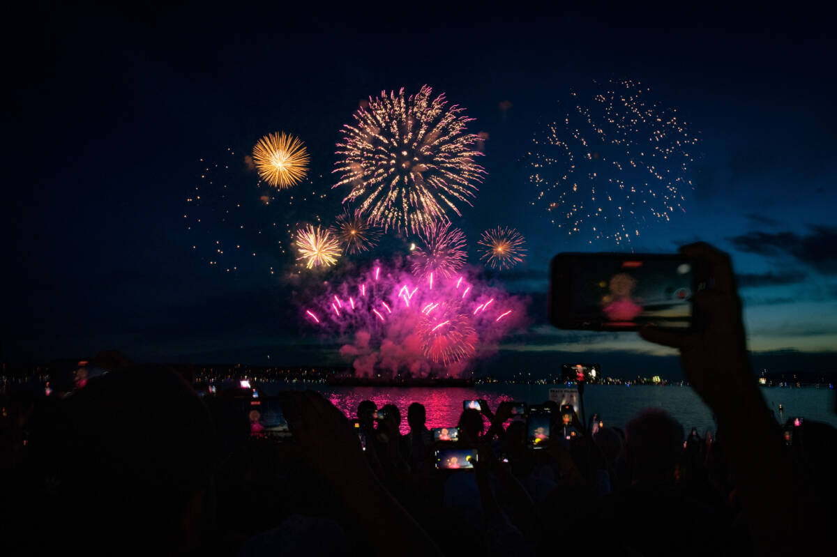 People film Team Australia’s firework display during the Honda Celebration of Light in Vancouver on Saturday, July 22, 2023. THE CANADIAN PRESS/Ethan Cairns