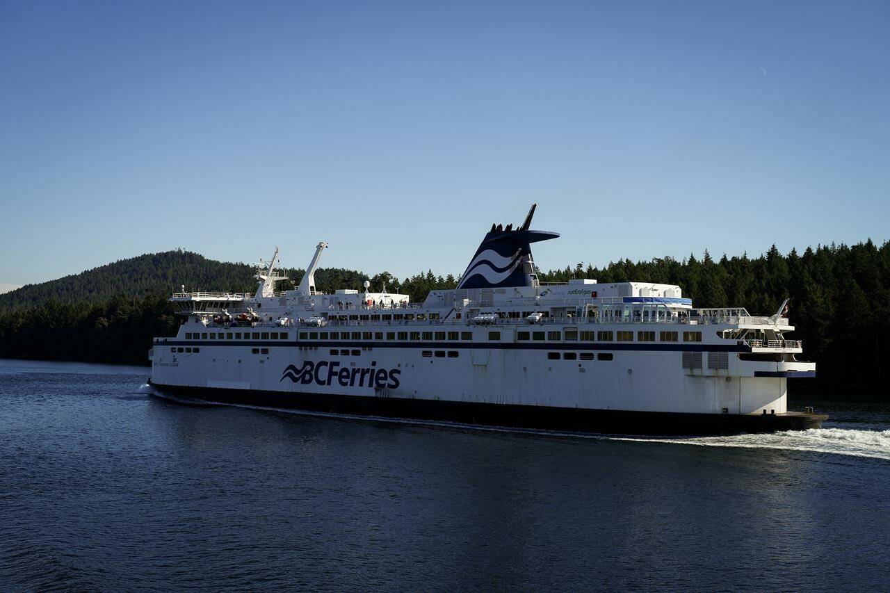 Canada Infrastructure Bank is lending $75 million to British Columbia’s ferry service to help buy four zero-emission vessels and install charging infrastructure. The BC Ferries vessel Spirit of Vancouver Island passes between Mayne Island and Galiano Island while travelling from Swartz Bay to Tsawwassen, B.C., Wednesday, Sept. 20, 2023. THE CANADIAN PRESS/Darryl Dyck