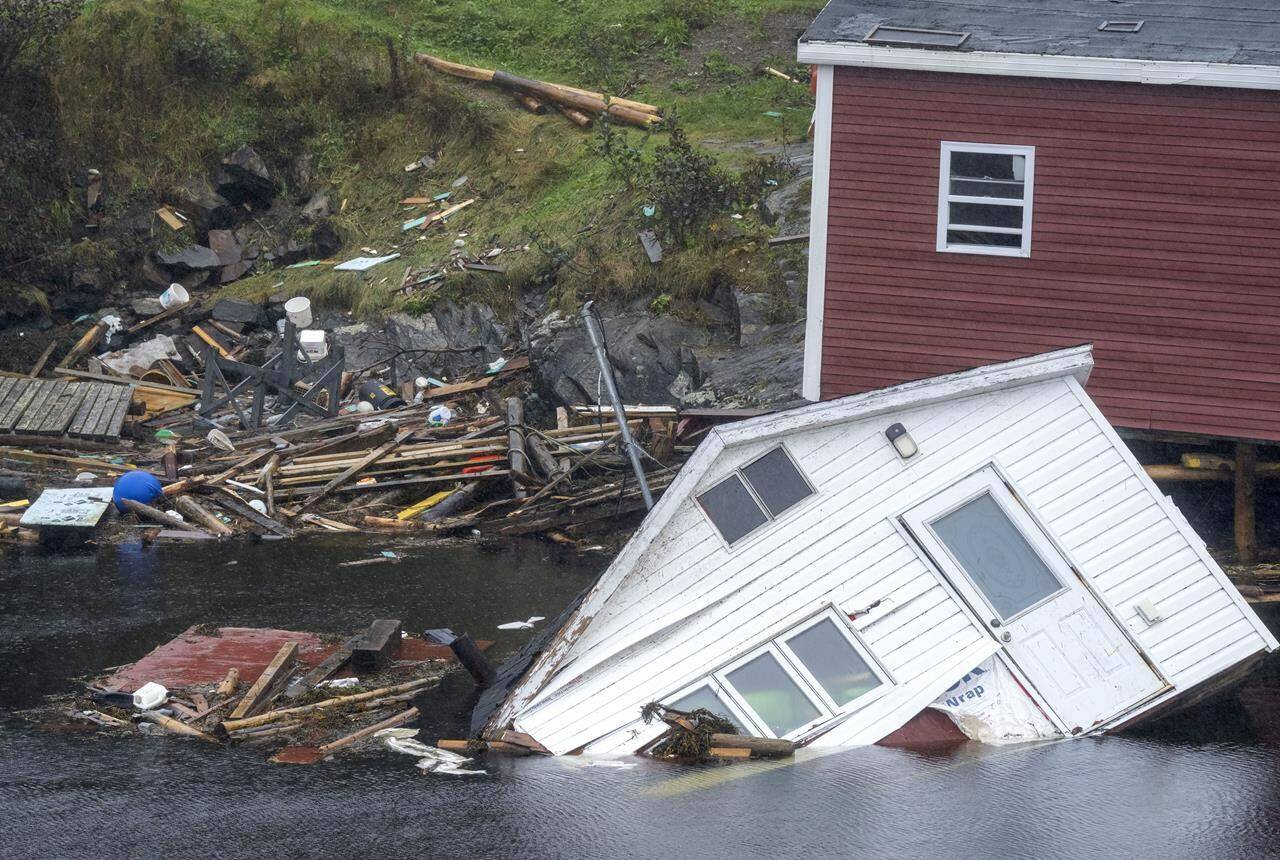 The Canadian Hurricane Centre is predicting an active storm season off the country’s East Coast this year, mainly due to record warm water temperatures in the Atlantic Ocean. Buildings sit in the water along the shore following hurricane Fiona in Rose Blanche-Harbour le Cou, N.L. on Tuesday, Sept. 27, 2022. THE CANADIAN PRESS/Frank Gunn