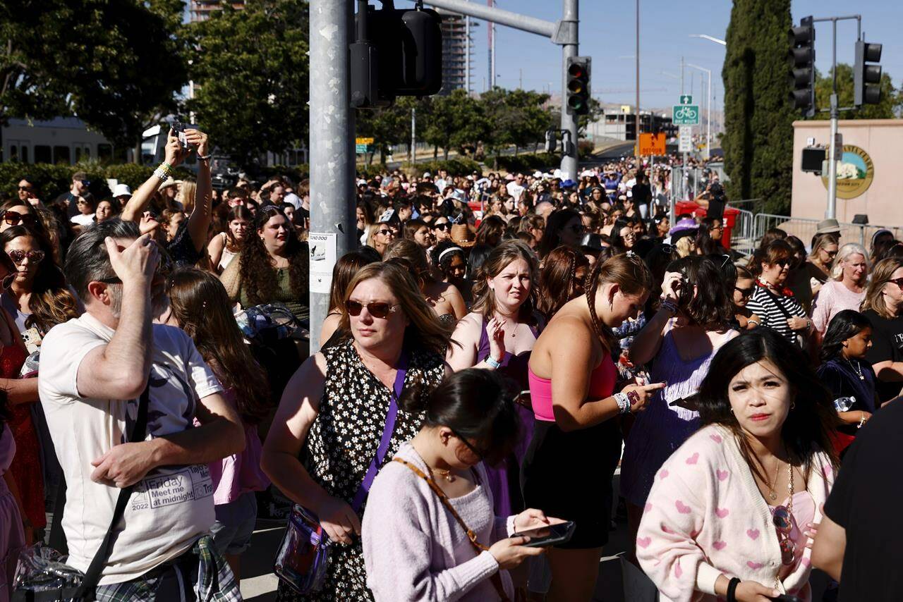 FILE - Fans wait to go through security before Taylor Swift performs at Levi’s Stadium in Santa Clara, Calif. on July 28, 2023. The 2022 fiasco after there were a myriad of problems with fans trying to buy tickets for Swift’s massive “Eras” tour shone a light on cracks in the ticketing system. (Jessica Christian/San Francisco Chronicle via AP, File)