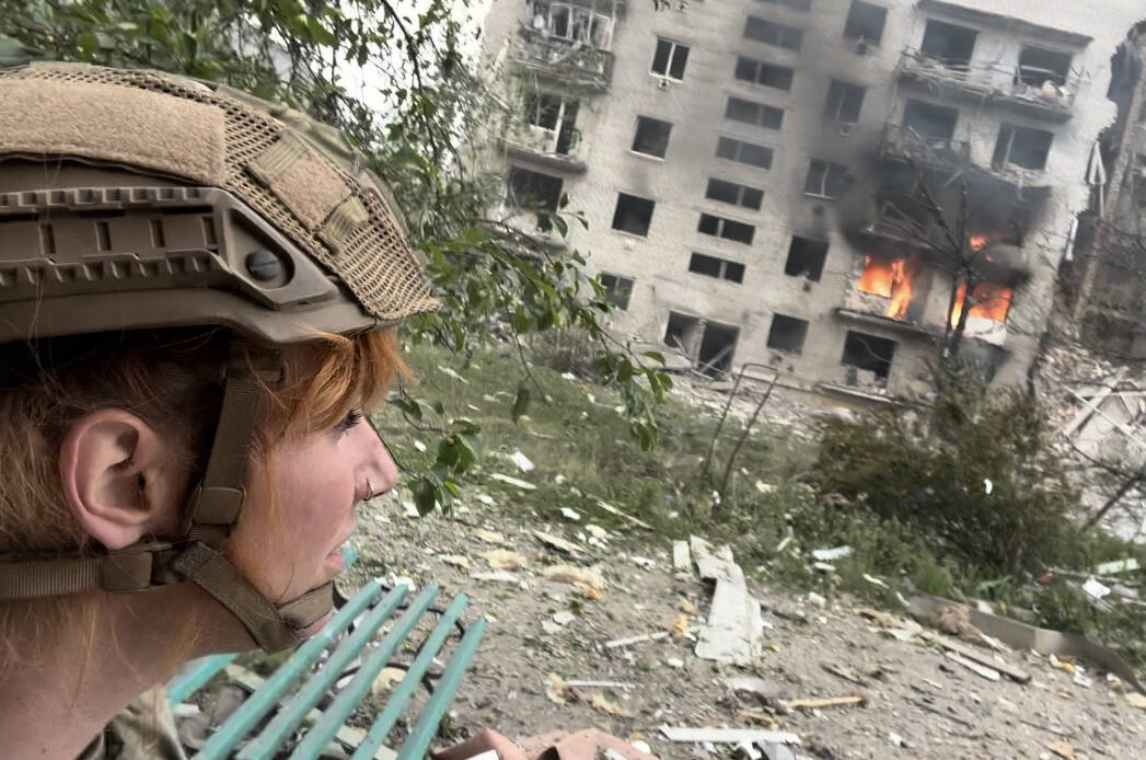 April Huggett stands in front of a building that was struck by a missile on May 16. She was two blocks away when the strike occurred. in Ukraine Photo: Submitted