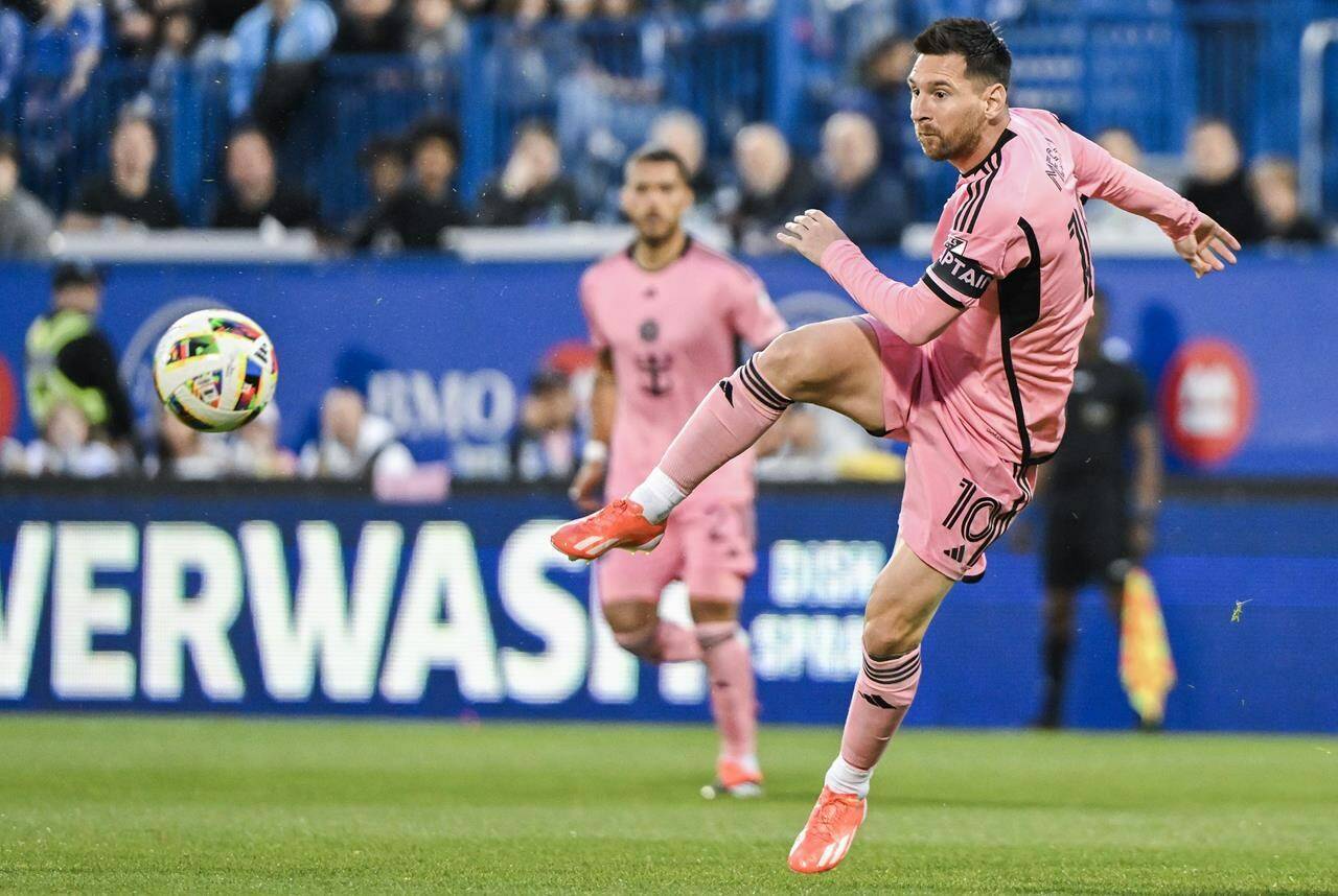 Inter Miami’s Lionel Messi passes the ball during MLS soccer action against CF Montreal in Montreal, Saturday, May 11, 2024. Messi continues to lead Major League Soccer, on the field and off it with a league-high $20,446,667 salary (all figures in U.S. dollars) this season. THE CANADIAN PRESS/Graham Hughes