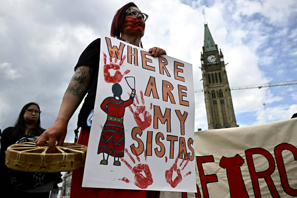 People rally on Parliament Hill on an International Day of Action to Search the Landfills, in Ottawa, on Monday, Sept. 18, 2023. The remains of Morgan Harris, Marcedes Myran and another woman named as Mashkode Bizhiki’ikwe, or Buffalo Woman, killed by an alleged serial killer, are believed to be in a landfill north of Winnipeg. THE CANADIAN PRESS/Justin Tang