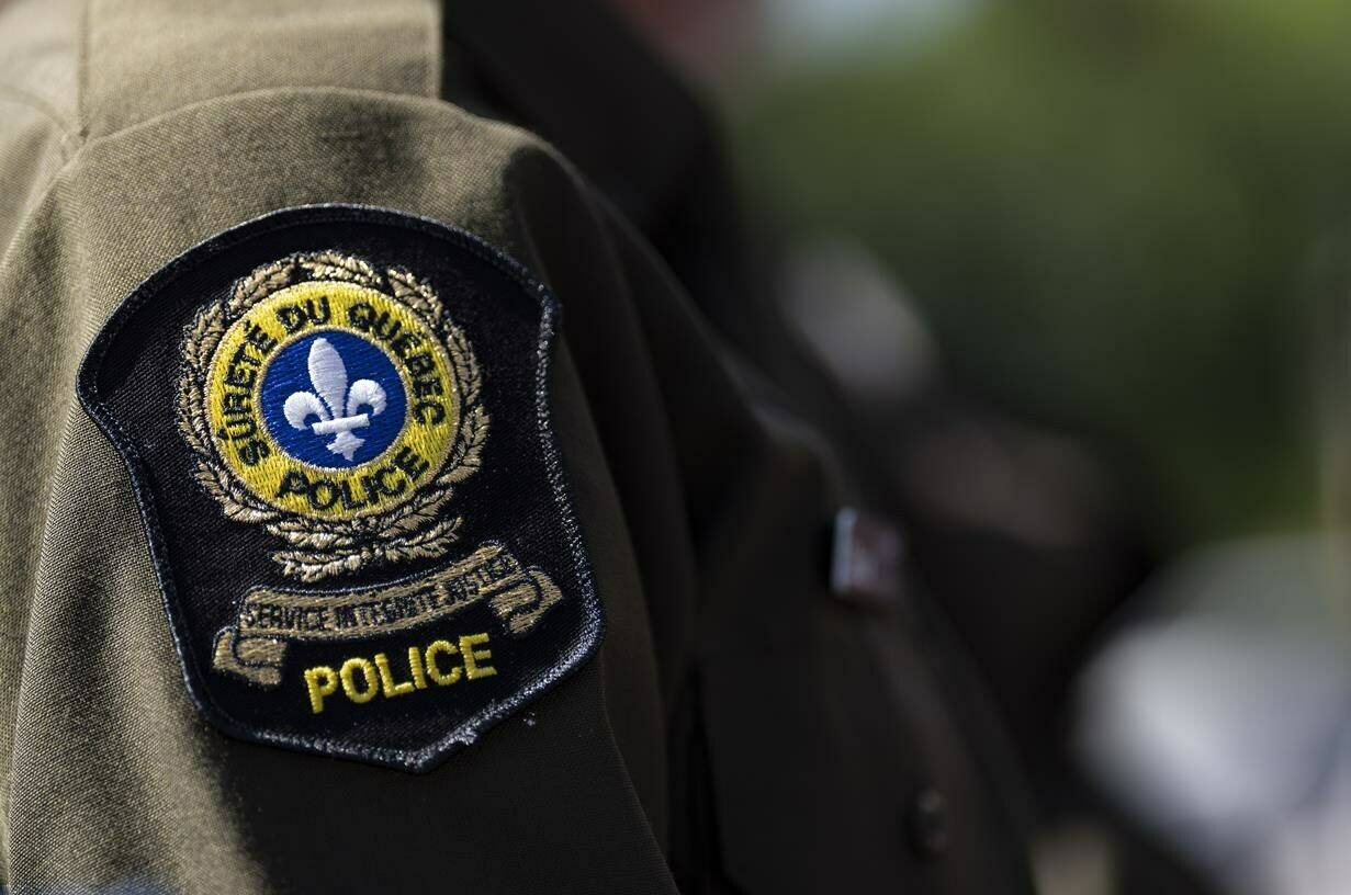 Quebec provincial police are investigating after an entire herd of about 75 Black Angus cattle were allegedly stolen in the Eastern Townships region last week. A Surete du Quebec emblem is seen on an officer’s uniform in Montreal, Tuesday, Aug. 22, 2023. THE CANADIAN PRESS/Christinne Muschi