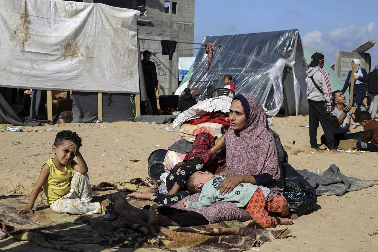 FILE - Palestinians displaced by the Israeli bombardment of the Gaza Strip set up a tent camp in Rafah on Dec. 6, 2023. The tent camps stretch for more than 16 kilometers (10 miles) along Gaza’s coast, filling the beach and sprawling into empty lots, fields and town streets. (AP Photo/Hatem Ali, file)