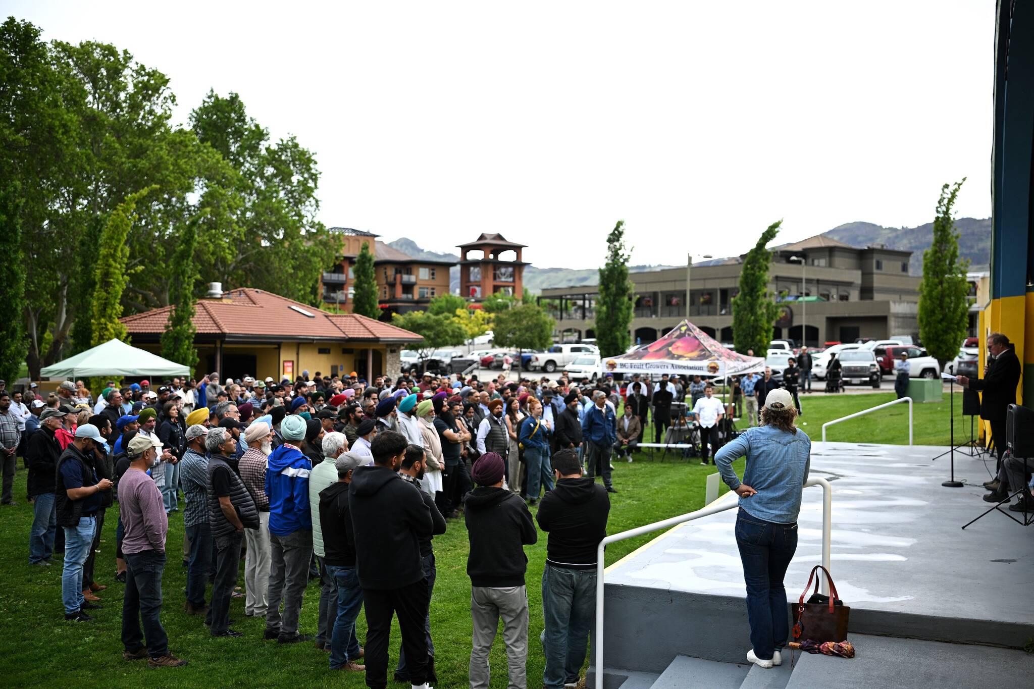 Hundreds braved the rain to show up for the Stronger Together Rally in Osoyoos on May 28, calling for support for the agricultural industry. (Brennan Phillips/Western News)