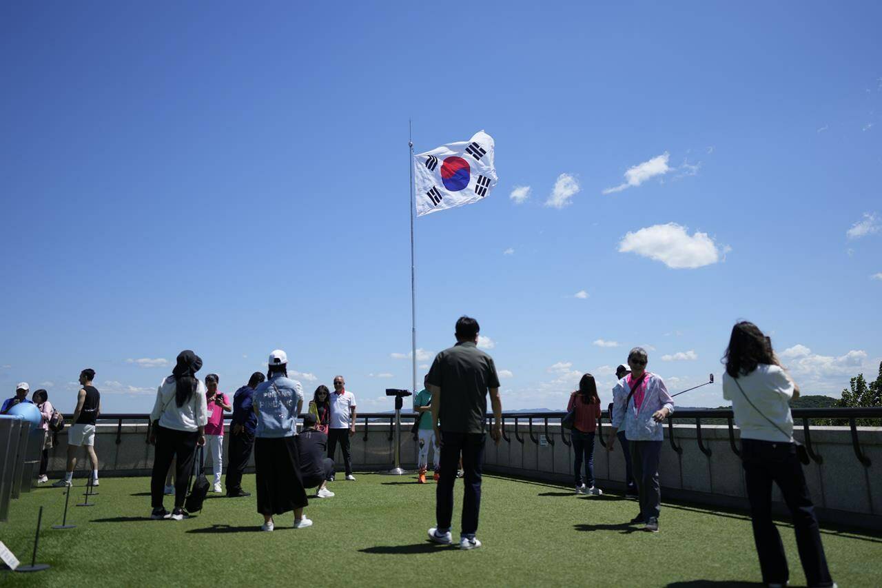 A South Korean national flag flutters in the wind at the unification observatory in Paju, South Korea, Tuesday, May 28, 2024. A rocket launched by North Korea to deploy the country’s second spy satellite exploded shortly after liftoff Monday, state media reported, in a setback for leader Kim Jong Un’s hopes to operate multiple satellites to better monitor the U.S. and South Korea. (AP Photo/Lee Jin-man)