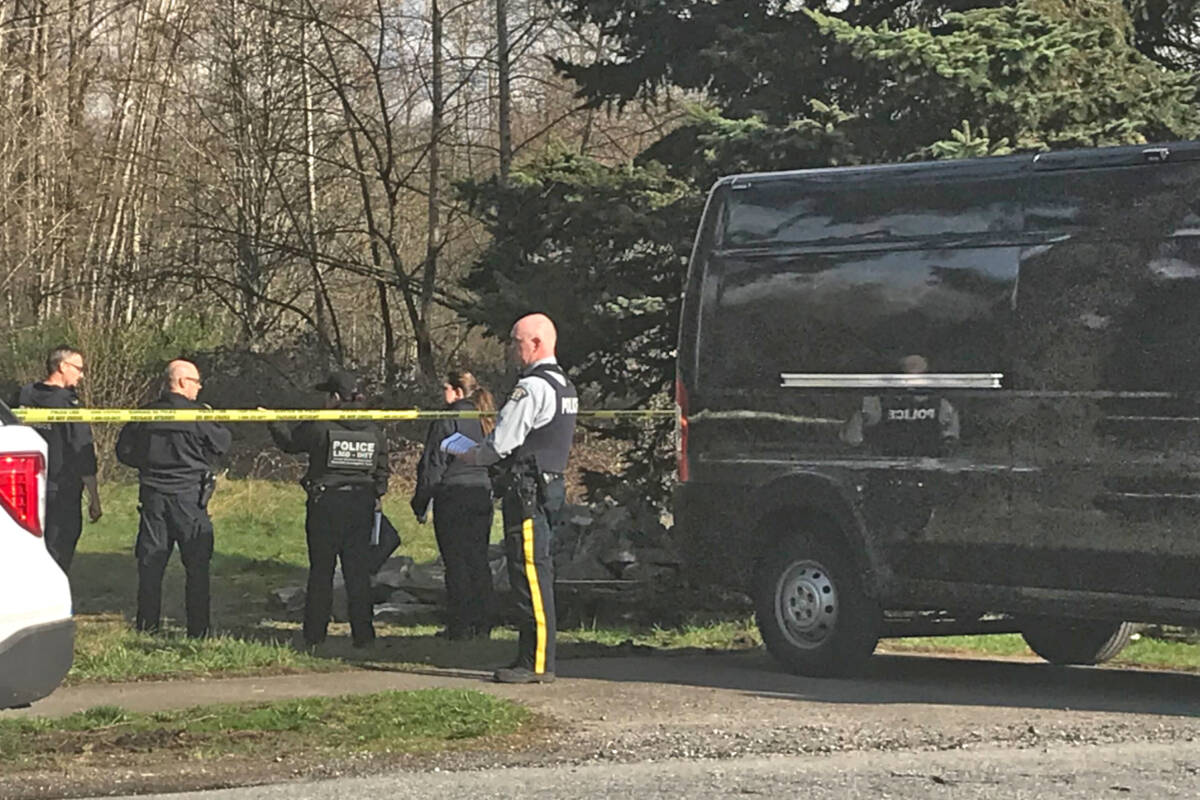 Investigators on scene in 2022 after Nicholas Ball’s body was discovered in a vacant lot on 208th Street. (Langley Advance Times files)