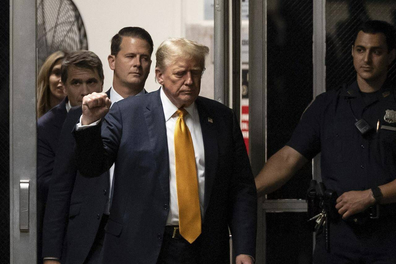 Former President Donald Trump gestures as he walks to the courtroom during his hush money trial at Manhattan criminal court, Wednesday, May 29, 2024, in New York. (Yuki Iwamura/Pool Photo via AP)