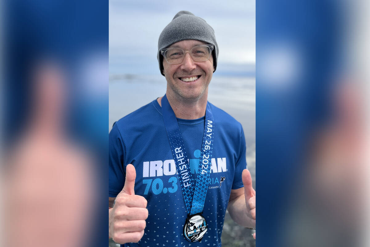Jamin Zuroski managed to finish the Ironman Triathlon and received the finishing medal, a medal that he himself had designed. (photo by Emily Buck)