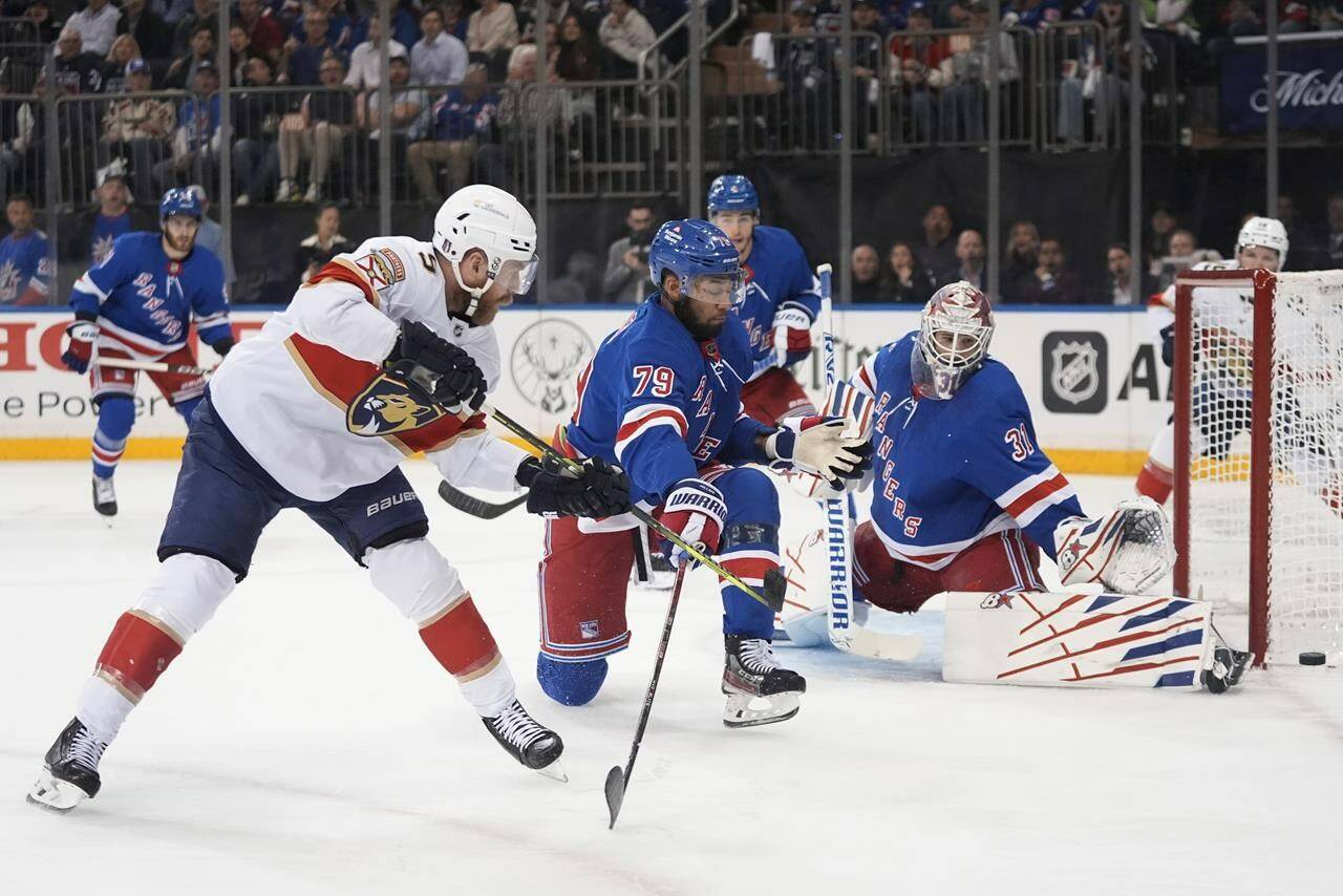 New York Rangers goaltender Igor Shesterkin (31) stops a shot by Florida Panthers’ Aaron Ekblad (5) during the first period of Game 5 in the Eastern Conference finals of the NHL hockey Stanley Cup playoffs Thursday, May 30, 2024, in New York, N.Y. (AP Photo/Frank Franklin II)