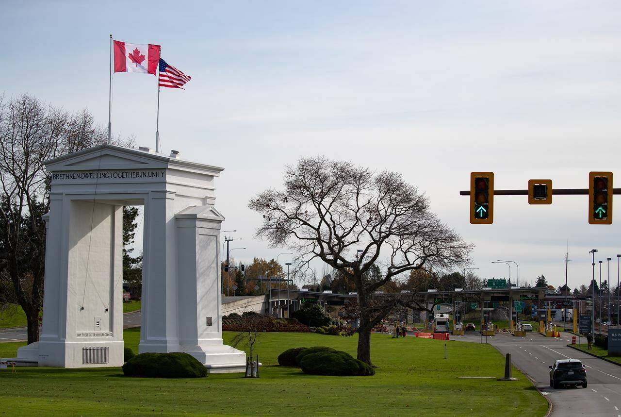 Motorists wait at U.S. Customs and Border Protection inspection booths at the Peace Arch border crossing in Blaine, Wash., across the Canada-U.S. border from Surrey, B.C., on Monday, November 8, 2021. A U.S. crackdown on foot crossings is taking place at Peace Arch Park, the unfenced park that straddles the border, in response to the increased operations of what U.S. Customs and Border Protection called “transnational criminal organizations.” THE CANADIAN PRESS/Darryl Dyck