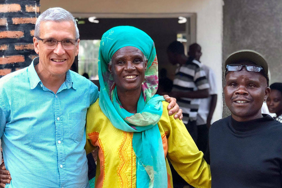 Carl Wilkens (left)  with Rwanda residents Maria and Filbert, who found themselves on the opposite sides of the genocide in 1994 in that African country. Despite Filbert being a member of a militia gang that killed Maria's husband and sons in 1994, today their relationship has evolved to where they have become close family friends. (Contributed)