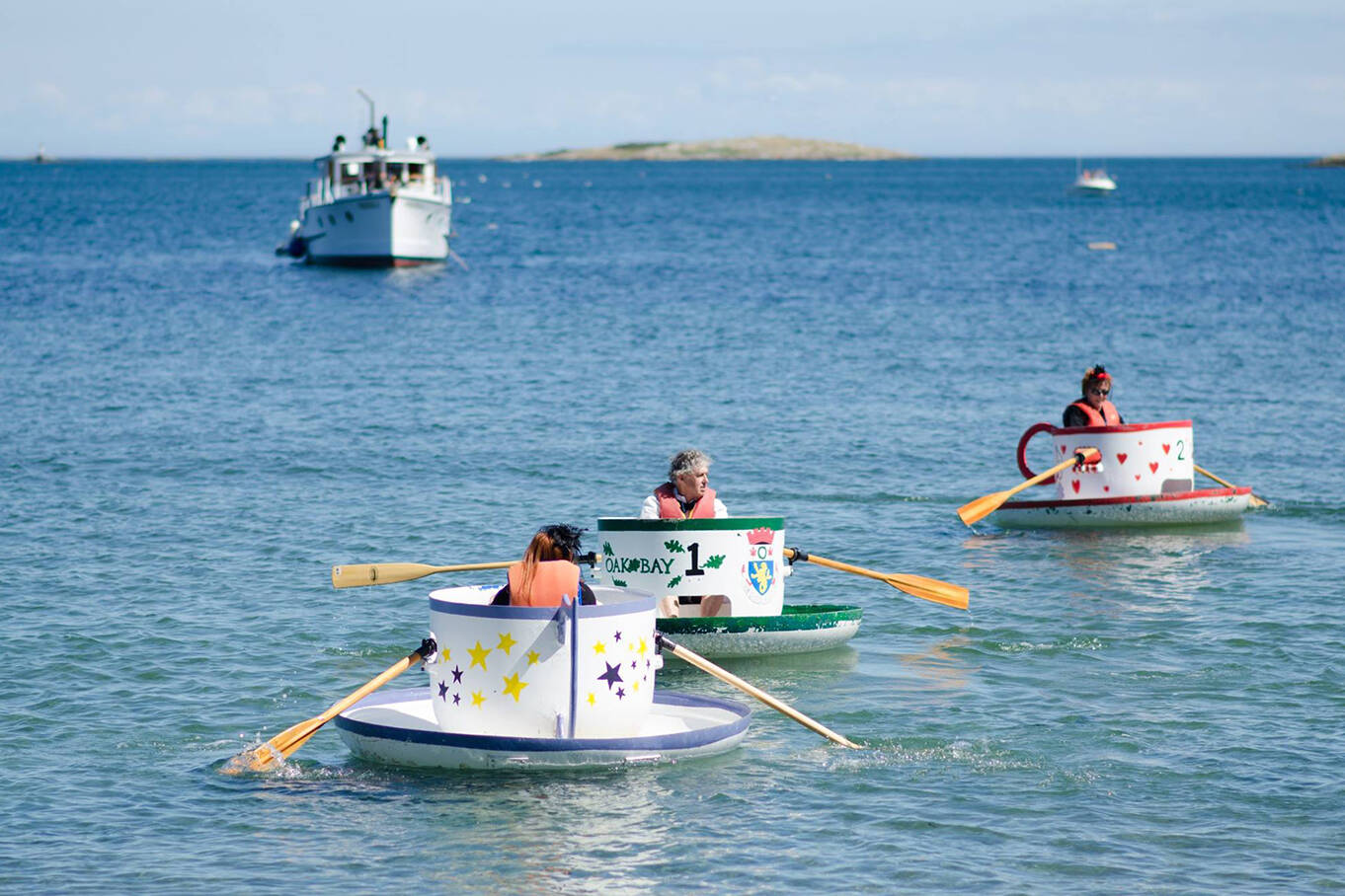 Oak Bay Tea Party Chair Sandy Germain, past Mayor Christopher Causton and Councillor Hazel Braithwaite paddle the waters off Willows Beach in the Mayors Tea Cup Challenge 2017. (Morgan Cross photo)