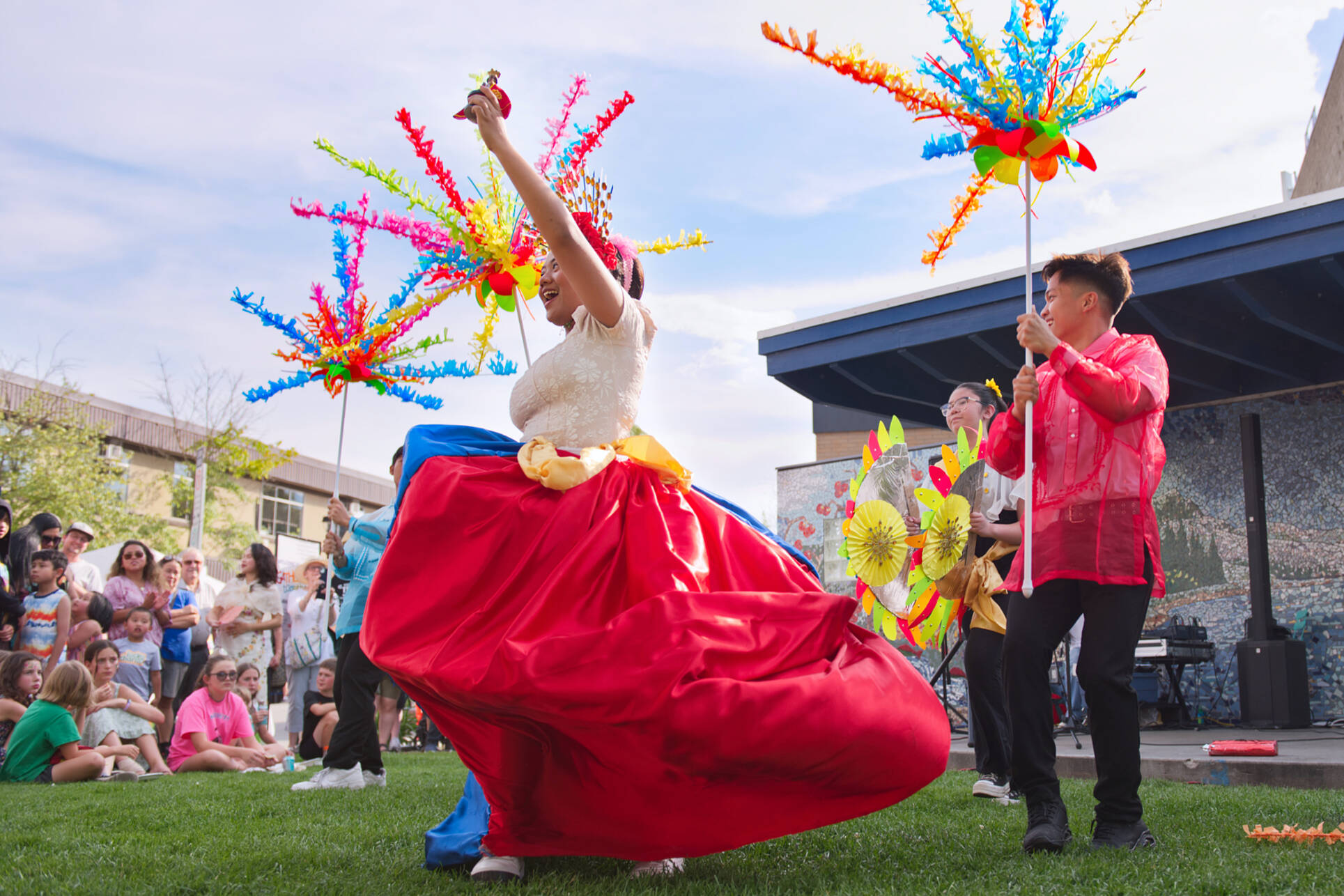 Samantha Sevidal and fellow Shuswap Filipino Canadian Community Youth members take part in a traditional dance at the Ross Street Plaza for the Gathering Together Festival held in downtown Salmon Arm on Multiculturalism Day, Tuesday, June 27, 2023. (Lachlan Labere-Salmon Arm Observer)