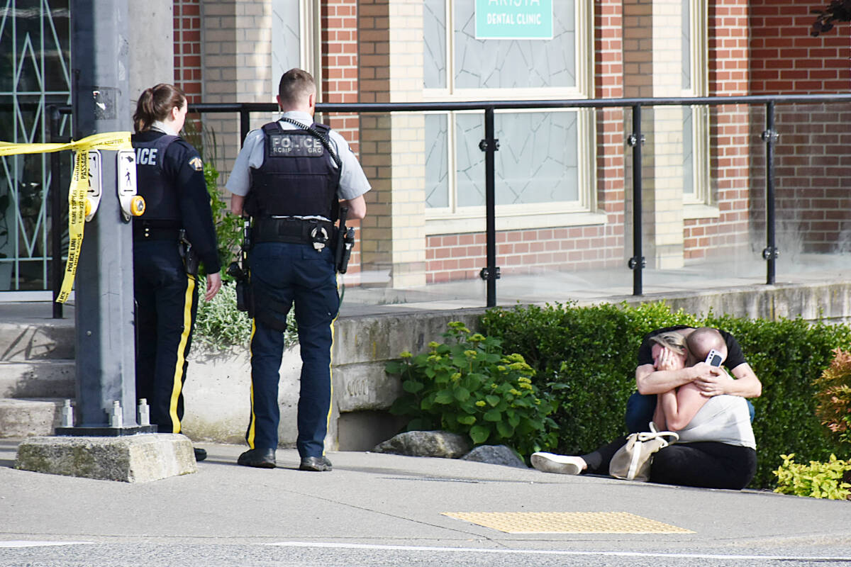 Wails and sobs could be heard coming from one woman on scene, with repeated cries “he’s gone.” Then two people could be seen consoling each other immediately following the shooting in downtown Maple Ridge last Friday, May 30, in the late afternoon. (Colleen Flanagan/The News)