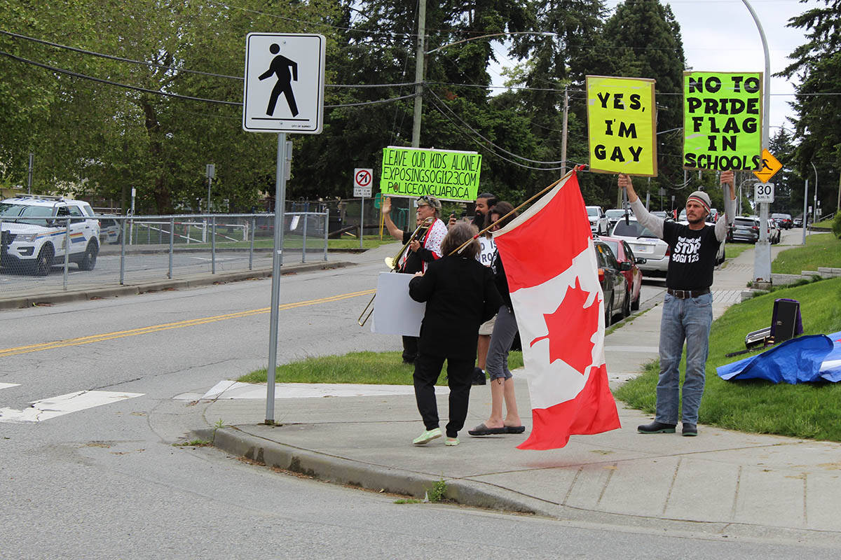 Anti-SOGI 123 protesters were outside Surrey’s L.A. Matheson Secondary on Monday afternoon (June 3) to begin their protests scheduled for most of Pride Month. (Sobia Moman photo)