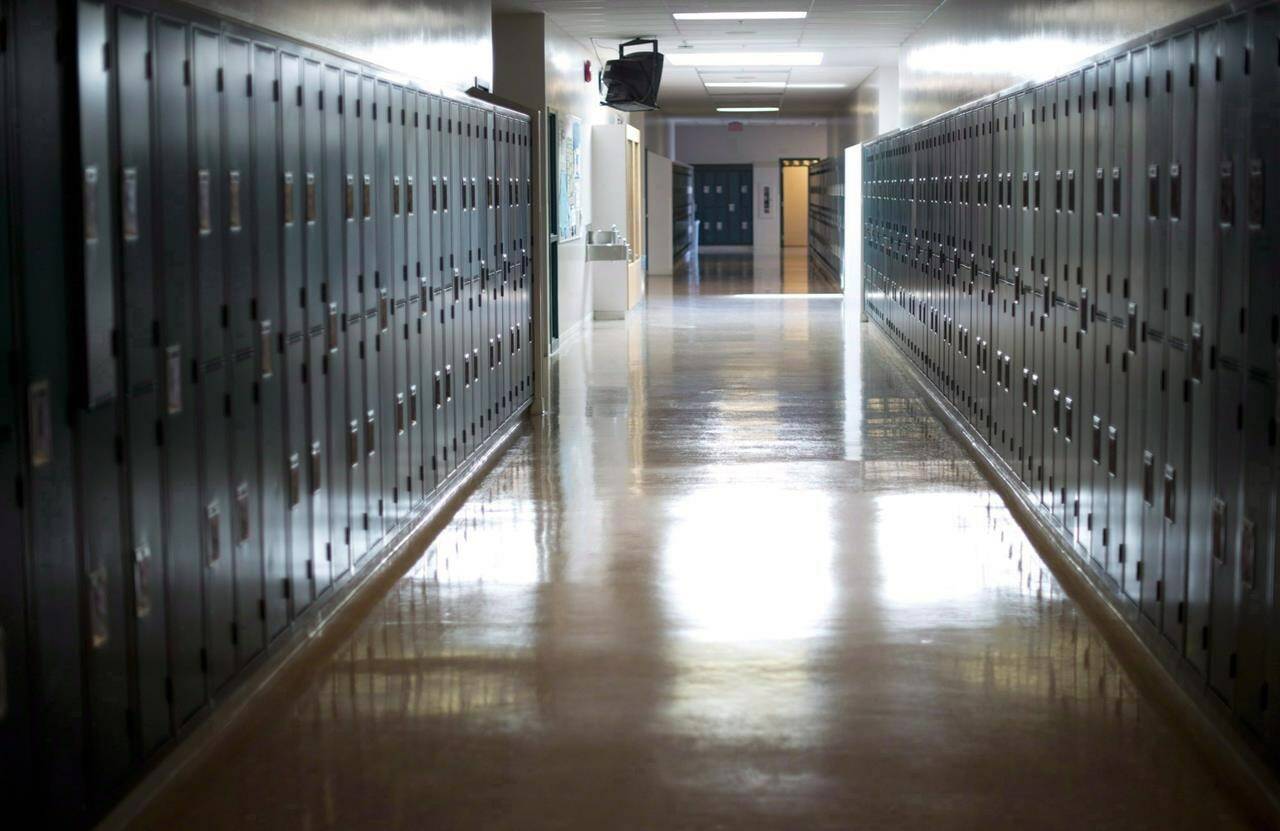 An empty hallway is seen at McGee Secondary school in Vancouver, on Sept. 5, 2014. Jewish organizations say the British Columbia Teachers’ Federation has denied recognition to the Holocaust and Antisemitism Educators Association for the development and funding of teaching resources. THE CANADIAN PRESS/Jonathan Hayward