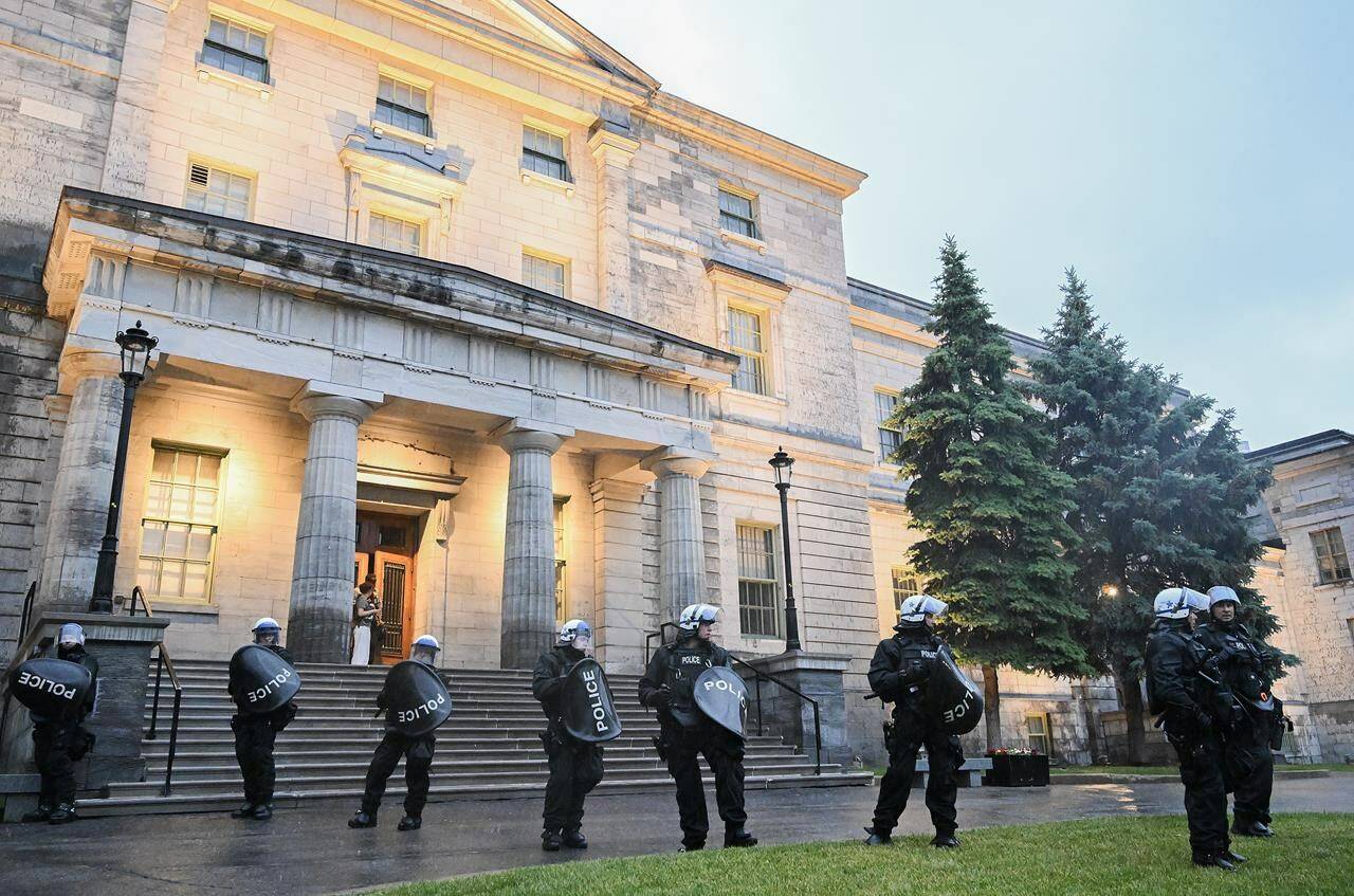 Police stand guard on the McGill University campus following a pro-Palestinian protest in Montreal, Thursday, June 6, 2024. THE CANADIAN PRESS/Graham Hughes