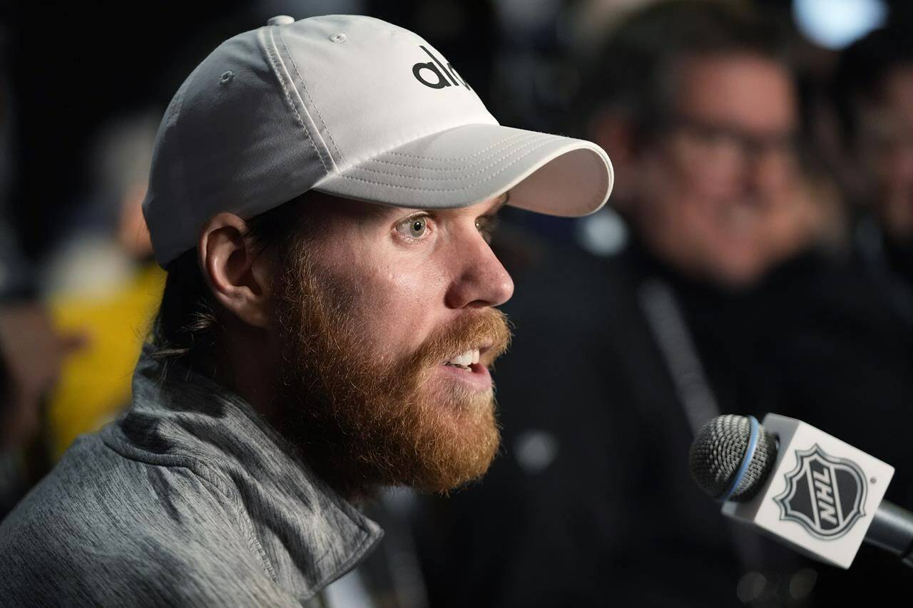 Edmonton Oilers center Connor McDavid answers questions during Media Day for the Stanley Cup Finals, Friday, June 7, 2024, in Sunrise, Fla. The Oilers take on the Florida Panthers in Game 1 on Saturday in Sunrise. (AP Photo/Wilfredo Lee)
