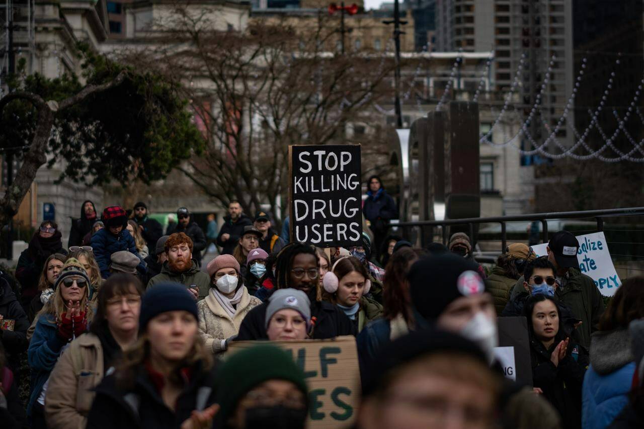 People gather outside the Provincial Court of British Columbia to support the Drug User Liberation Front in Vancouver, B.C., Tuesday, Jan. 16, 2024. THE CANADIAN PRESS/Ethan Cairns