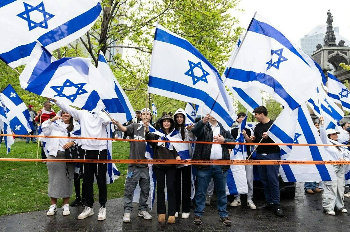 Supporters of Israel gather to celebrate the country’s Independence Day in Montreal on Tuesday, May 14, 2024. A pro-Israel march is set to take place today in Toronto amid heightened security and a related protest. THE CANADIAN PRESS/Christinne Muschi
