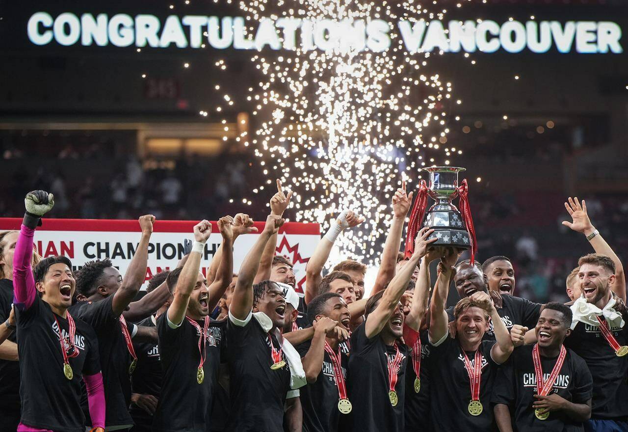 Fans will have to wait to see who makes it to the final of the Canadian Championship. Vancouver Whitecaps’ Russell Teibert, front third right, and Ryan Gauld, front second right, hoist the Voyageurs Cup after Vancouver defeated CF Montreal 2-1 during the Canadian Championship soccer final, in Vancouver, B.C., Wednesday, June 7, 2023. THE CANADIAN PRESS/Darryl Dyck