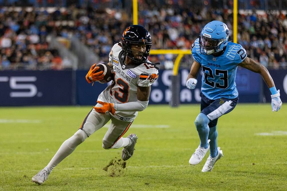 B.C.’s Alexander Hollins tries to evade Toronto’s Benjie Franklin during Sunday night’s game at BMO Field in Toronto. The Argonauts beat the Lions 35-27 in the season opener for both teams. Steve Chang BC Lions