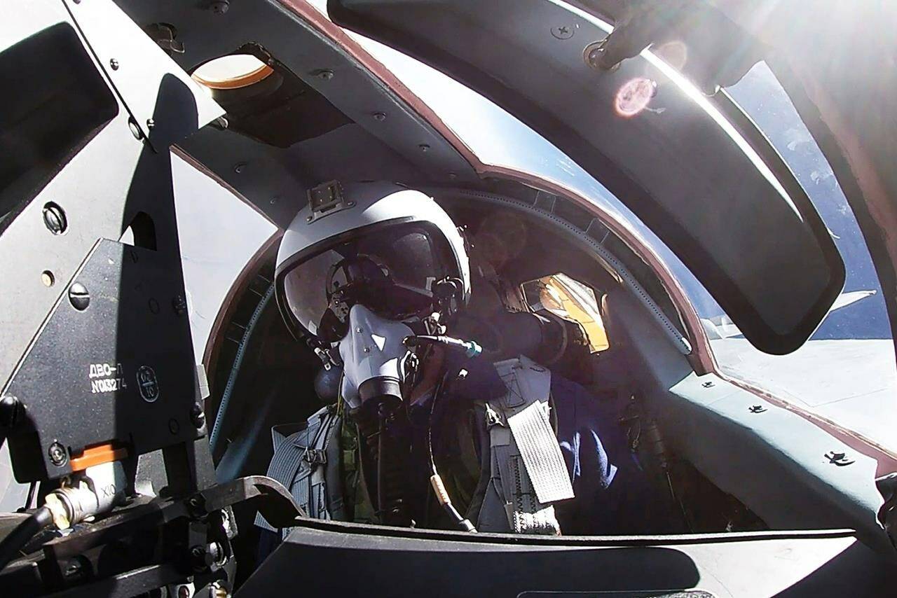 In this photo taken from video on Monday, June 10, 2024, and released by the Russian Defense Ministry Press Service, a pilot sits in a cockpit of a MiG-31 fighter jet of the Russian air force during joint Russian-Belarusian drills intended to train the military to use tactical nuclear weapons. (Russian Defense Ministry Press Service via AP)