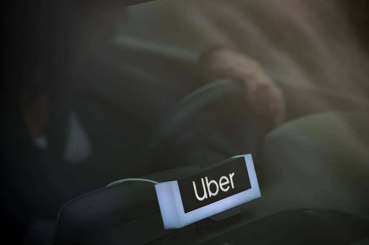 An Uber driver is seen in Vancouver, Friday, Jan. 24, 2020. British Columbia has finalized regulations to provide minimum-wage measures and basic protections for ride-hailing and delivery workers using app-based platforms such as Uber, Lyft, DoorDash and SkipTheDishes. THE CANADIAN PRESS/Darryl Dyck