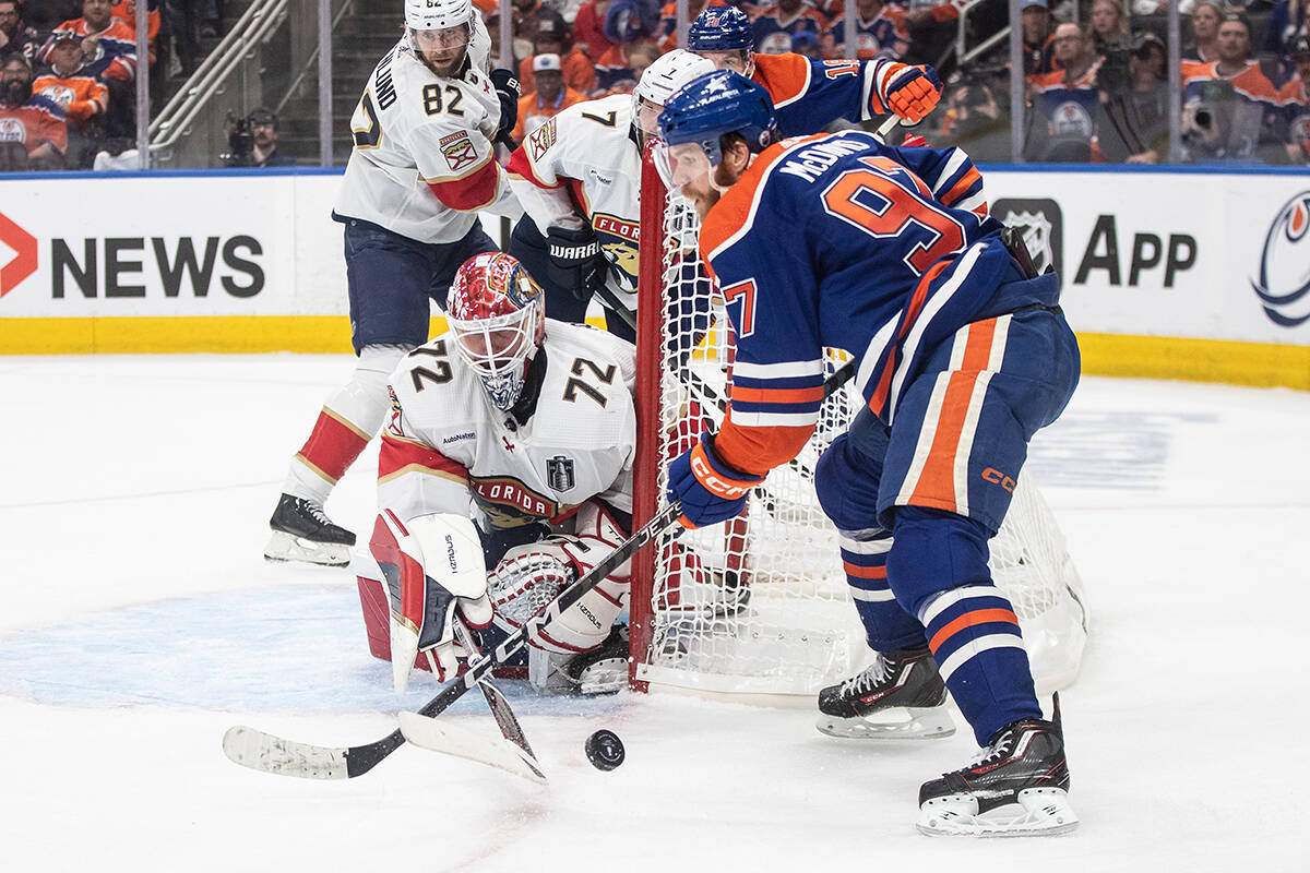 Florida Panthers goalie Sergei Bobrovsky (72) makes the save on Edmonton Oilers’ Connor McDavid (97) during second period Game 3 action of the NHL Stanley Cup final in Edmonton on Thursday, June 13, 2024.THE CANADIAN PRESS/Jason Franson